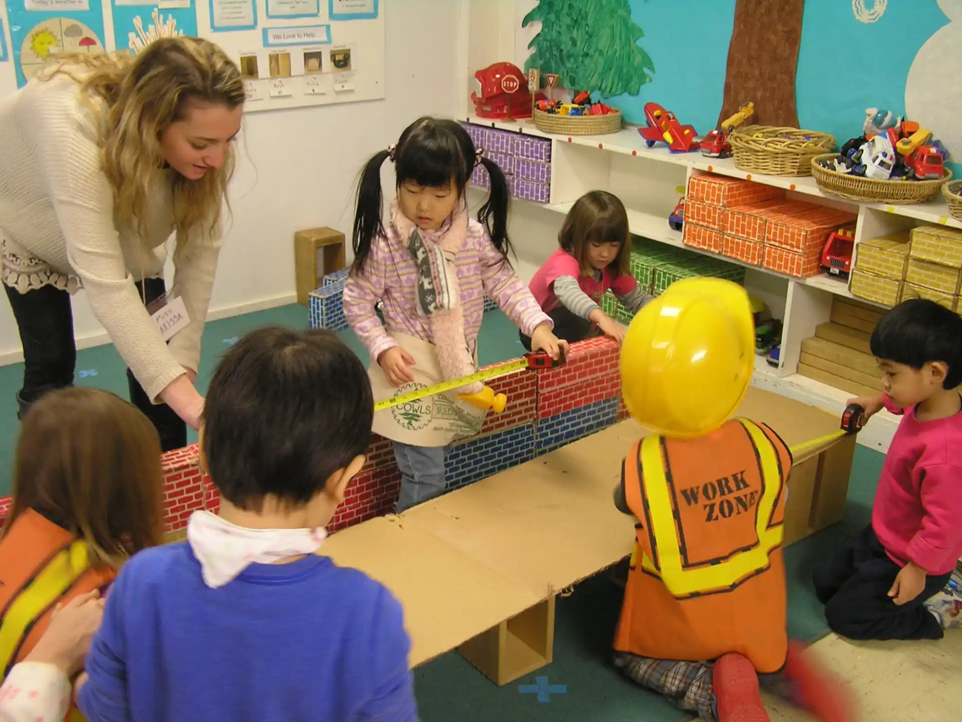 a person and children in a classroom
