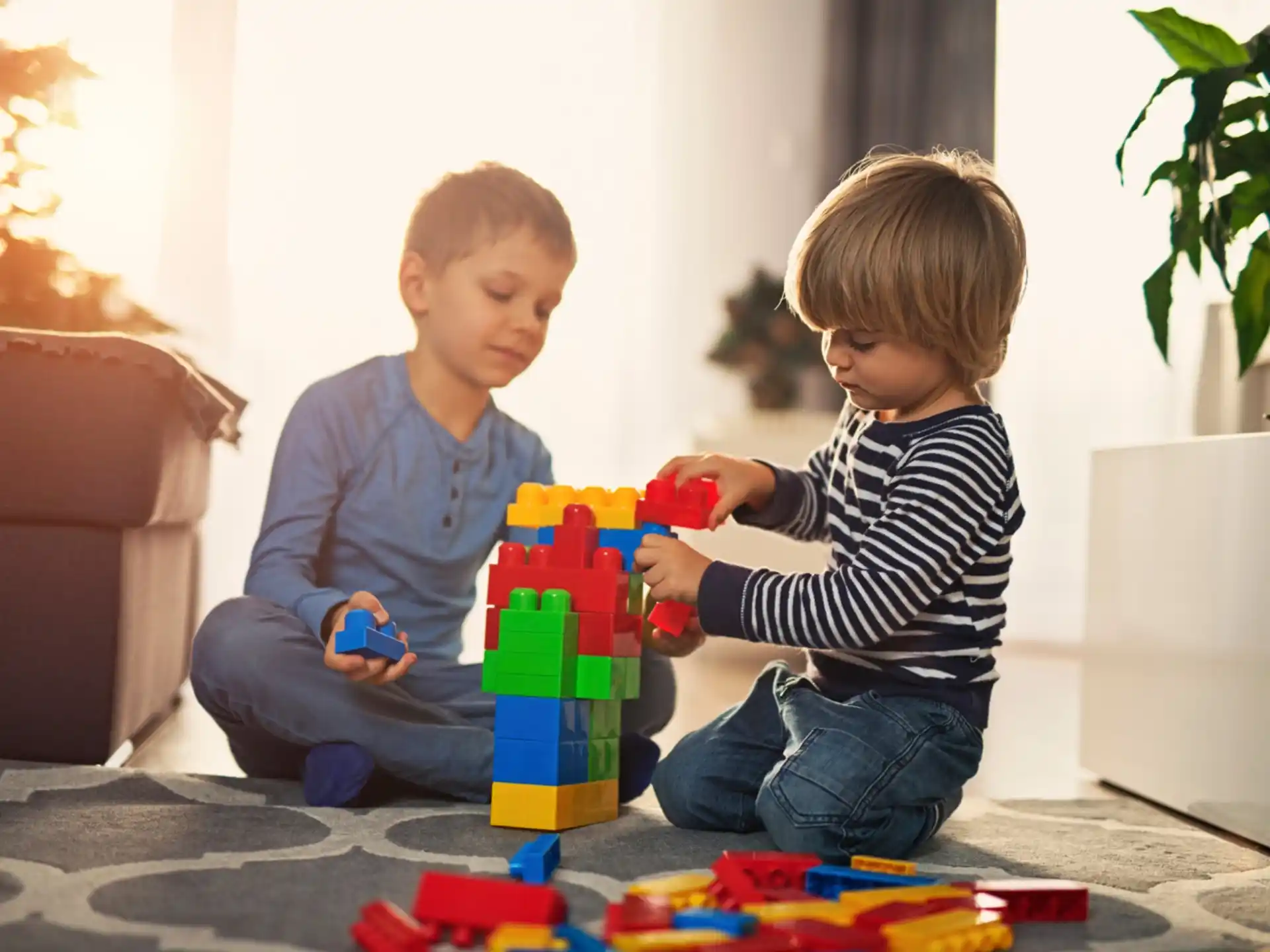 a couple of boys playing with toys