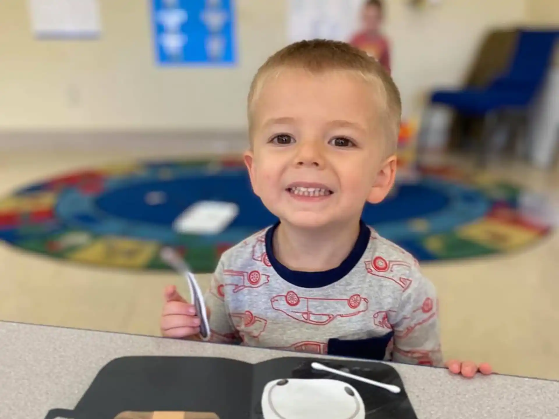 a baby sitting at a table