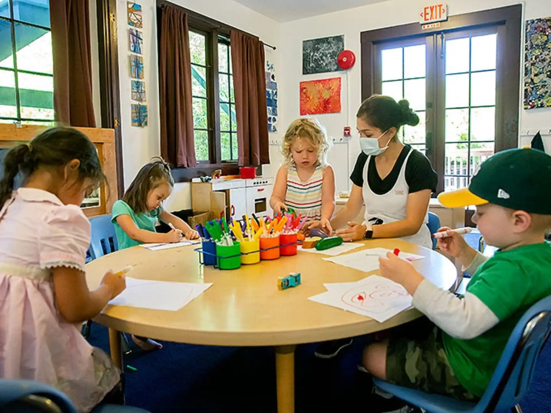 a group of children sitting at a table