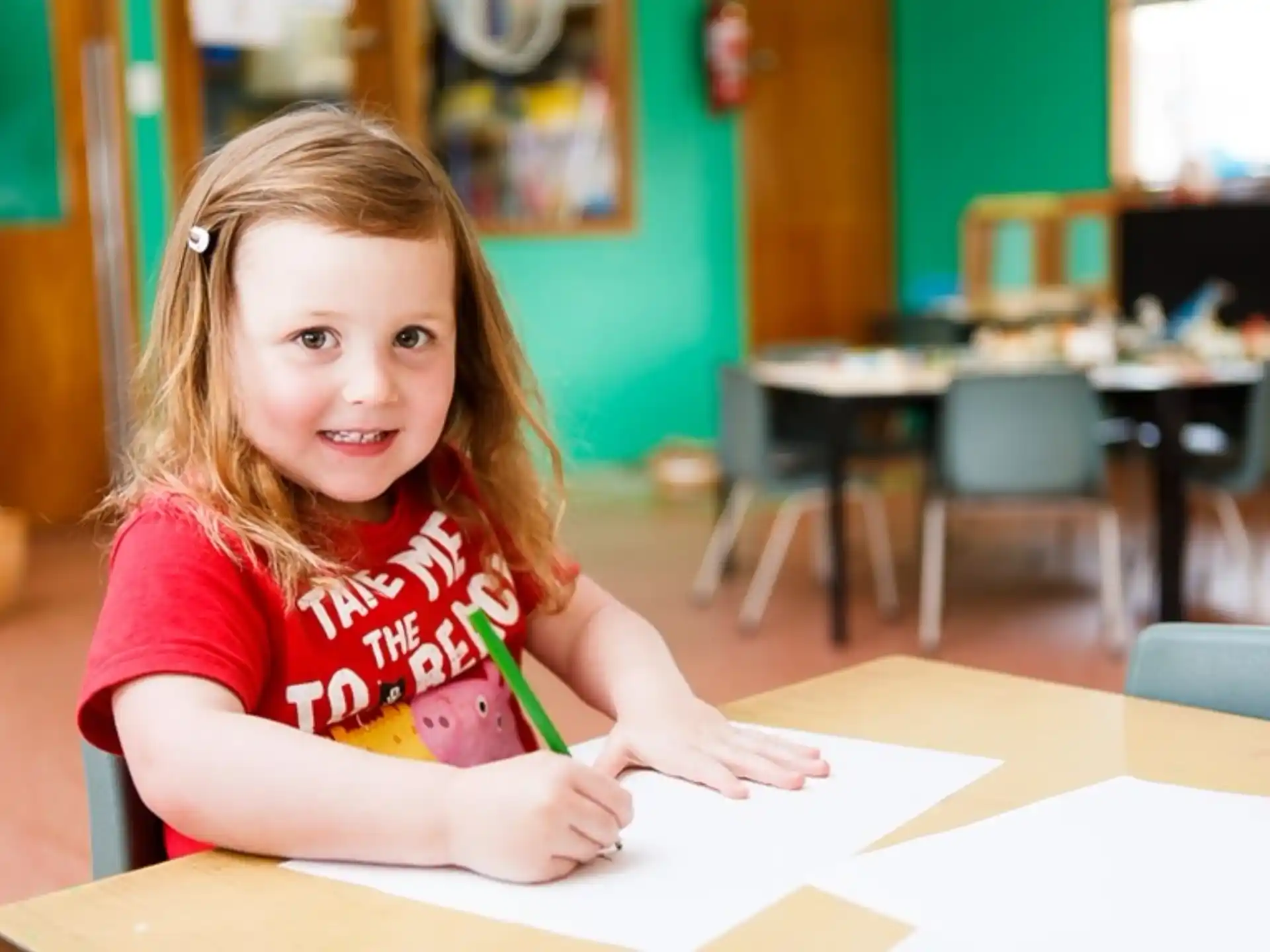 a girl sitting at a table