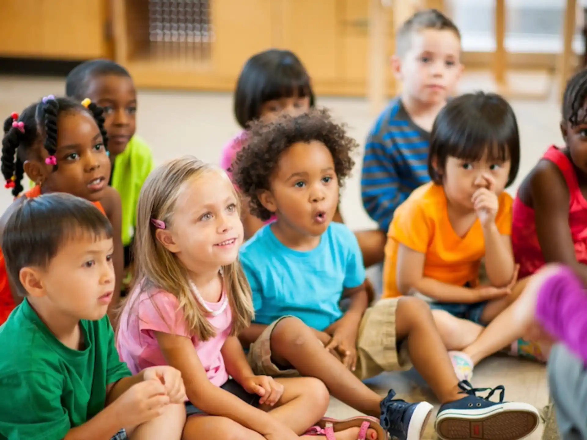 a group of children sitting on the floor