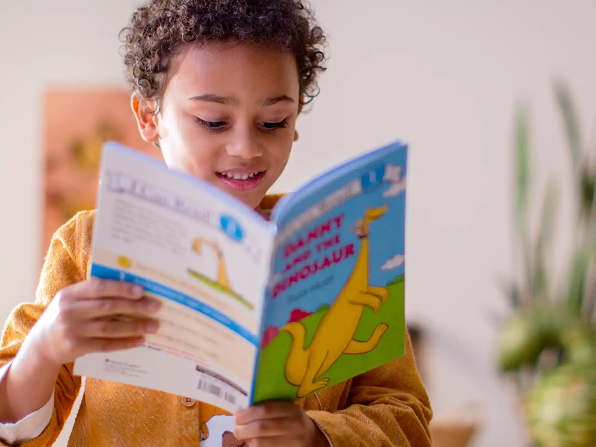 a young girl reading a book