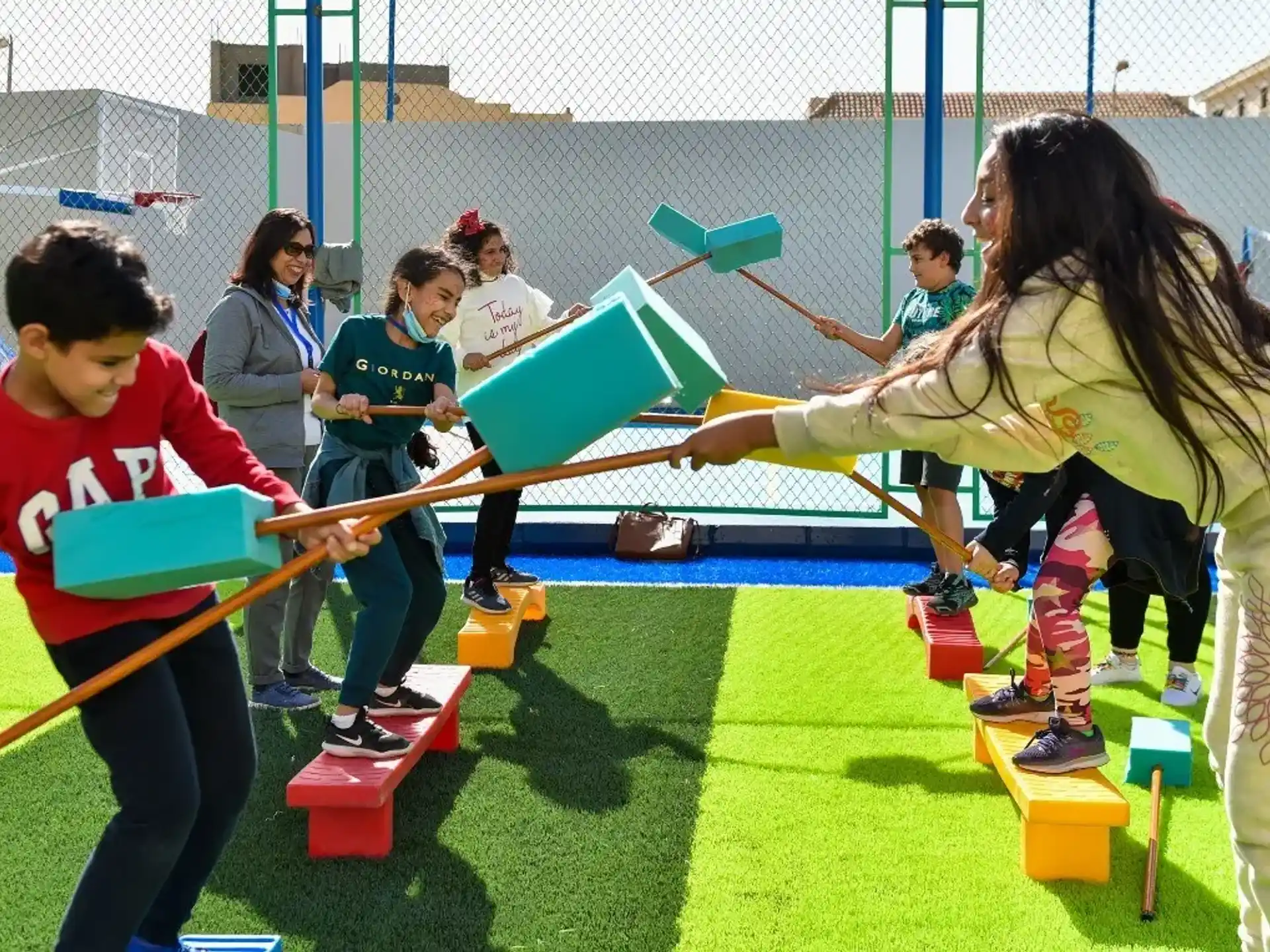 a group of kids playing on a playground