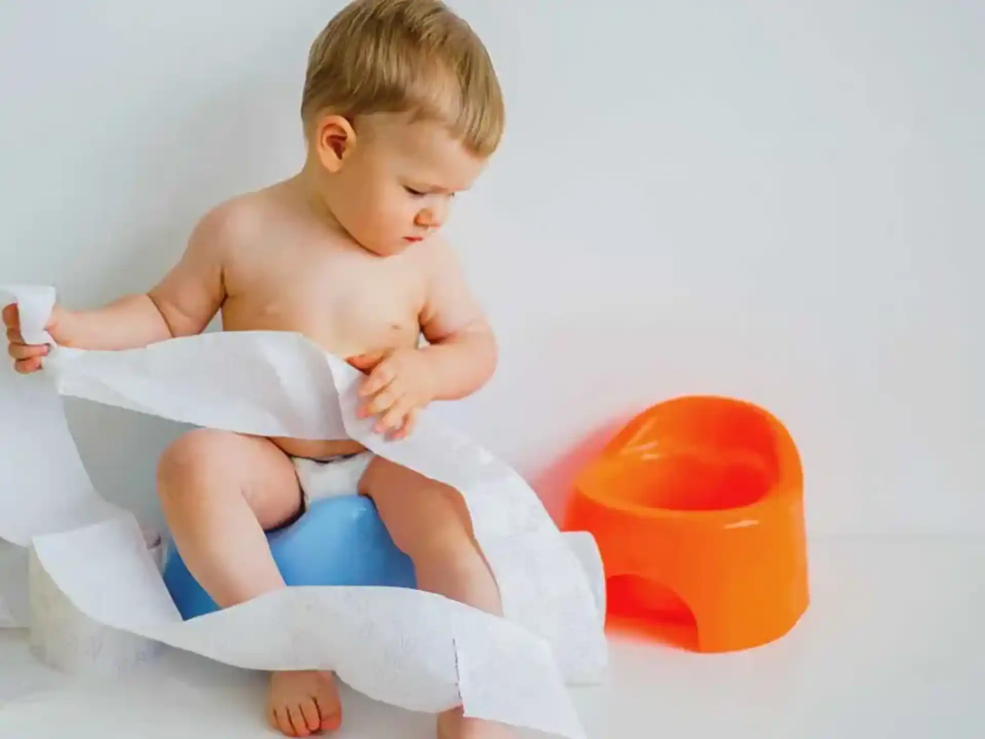 a baby sitting on a chair