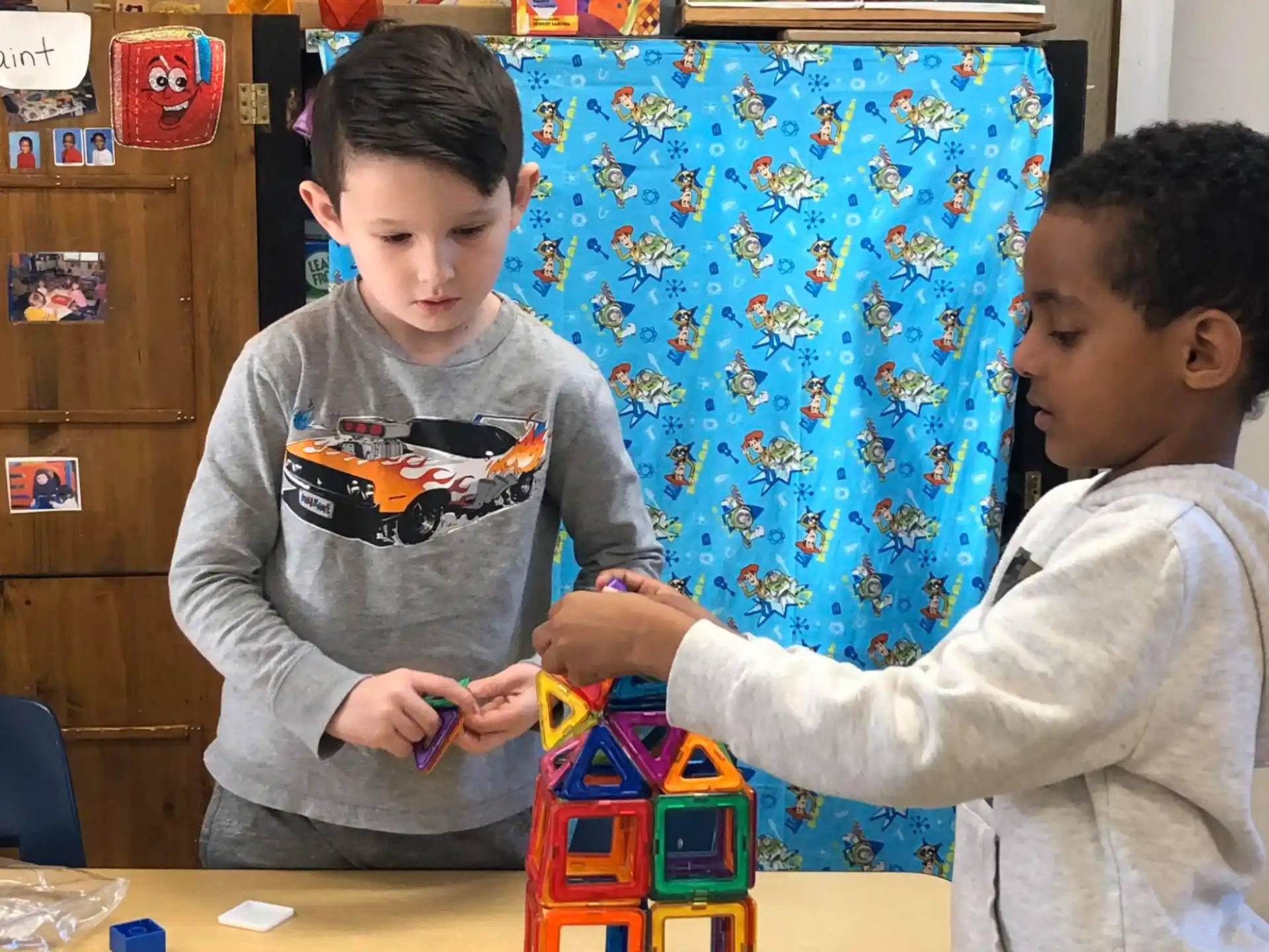 a couple of boys playing with toys