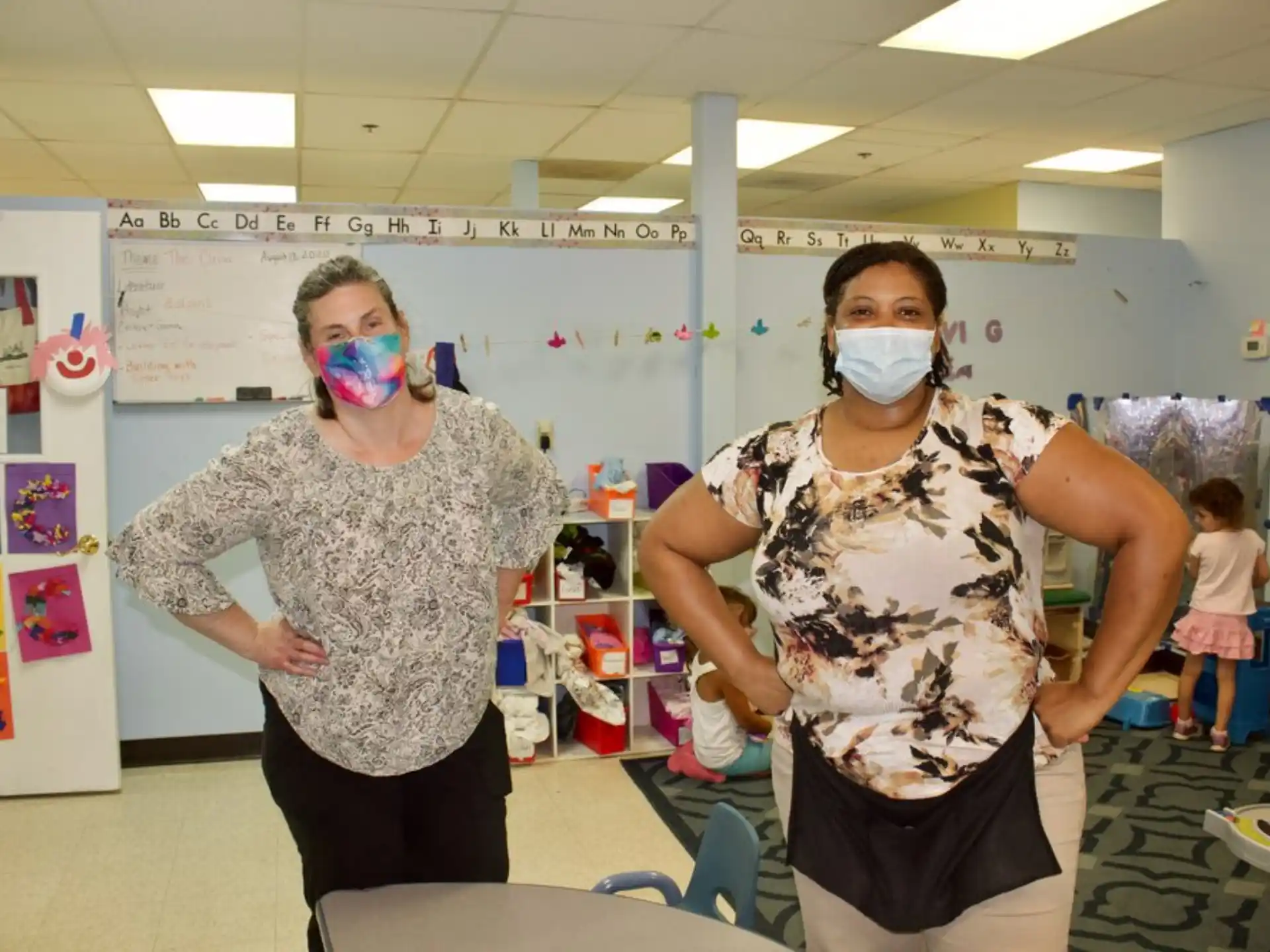 a group of women wearing face masks