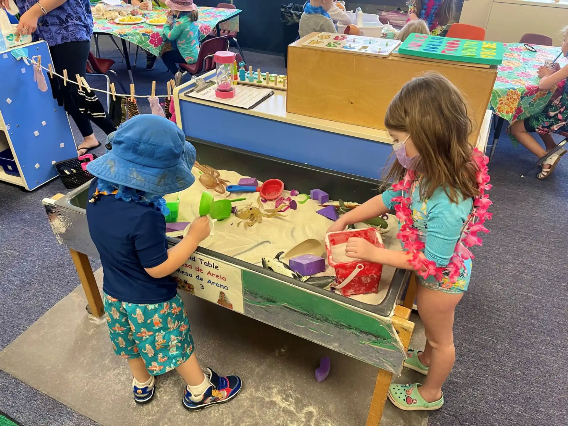 children painting on a table
