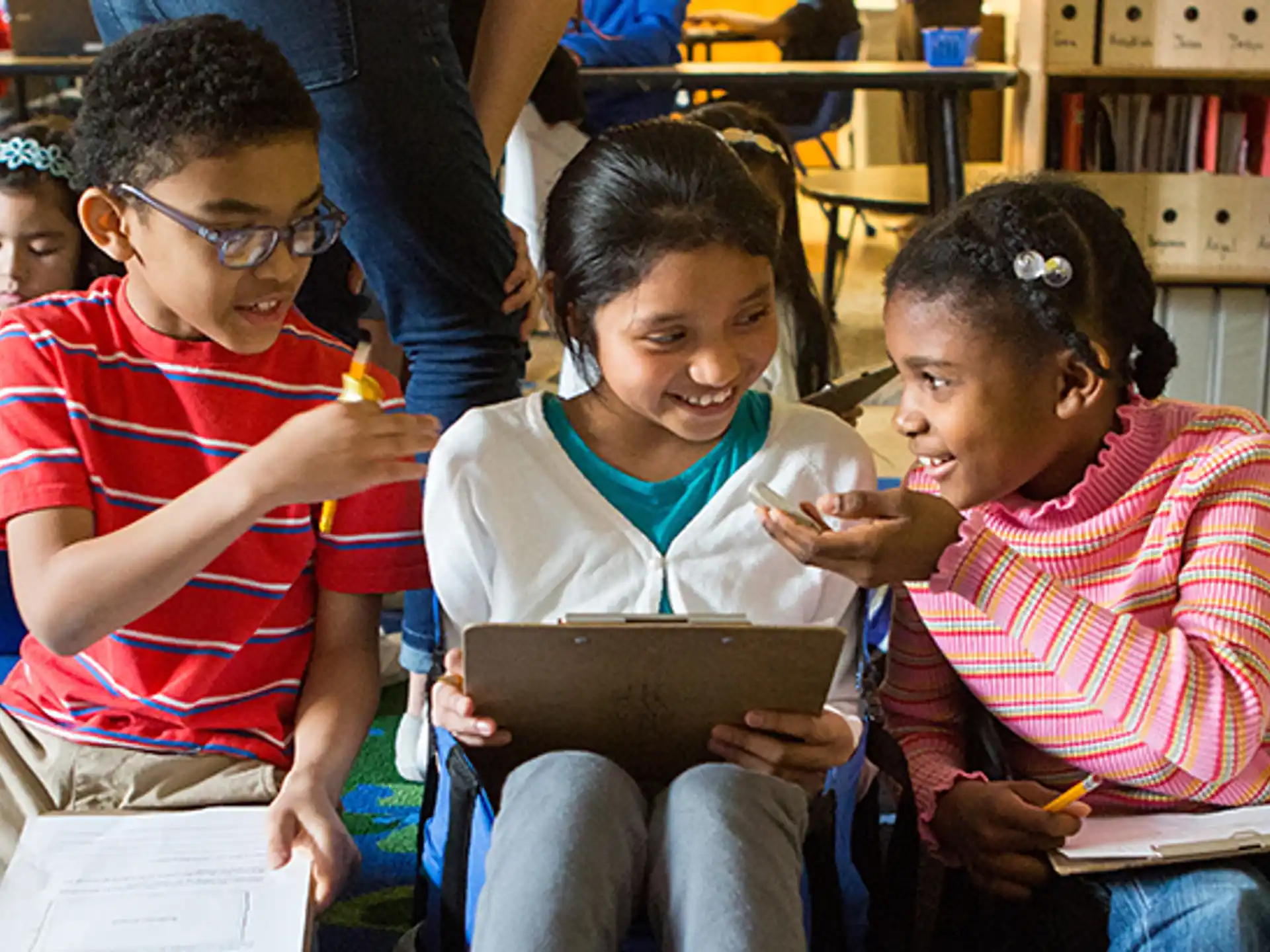 a group of children sitting in a library
