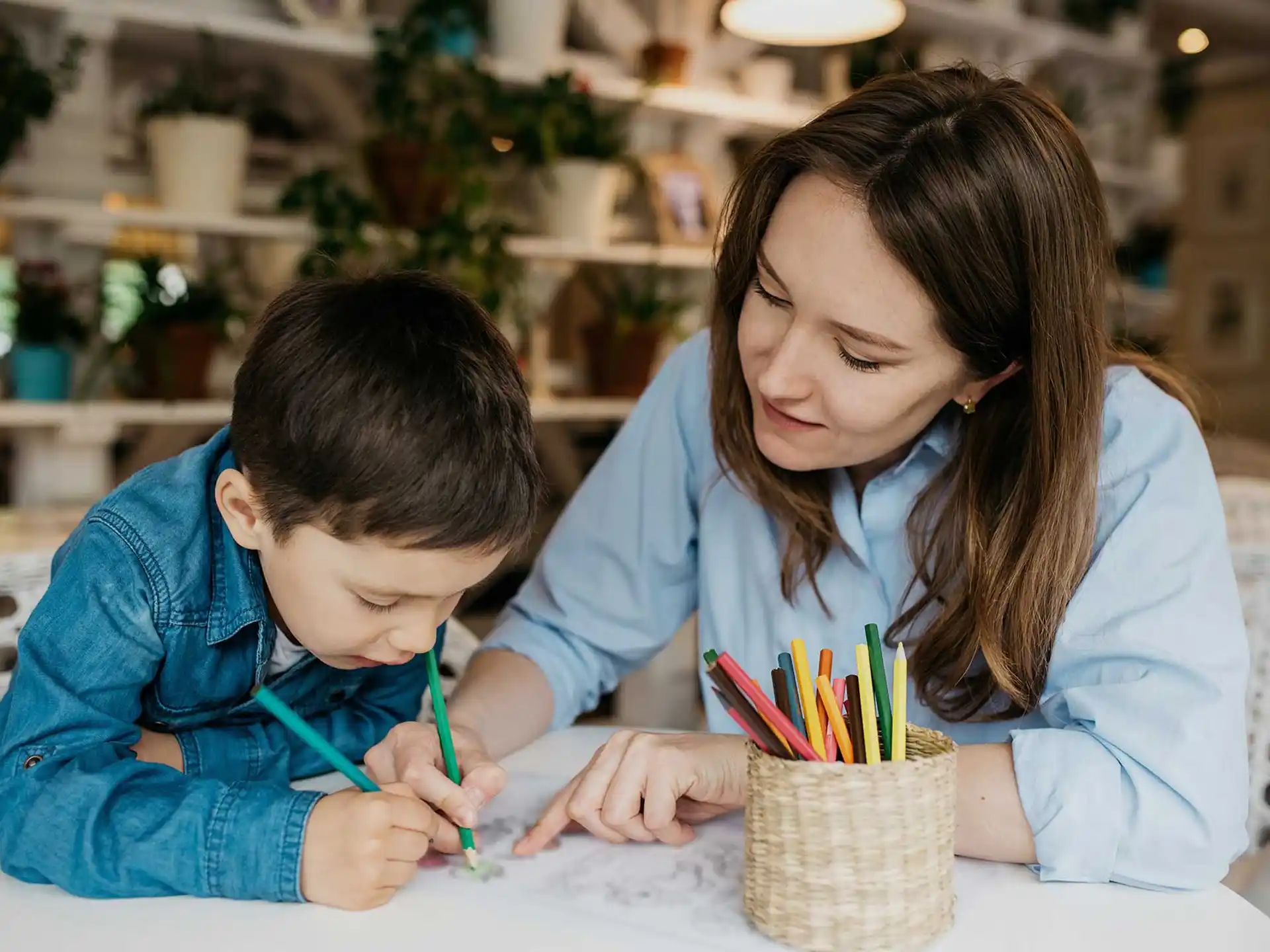 a person and a boy painting
