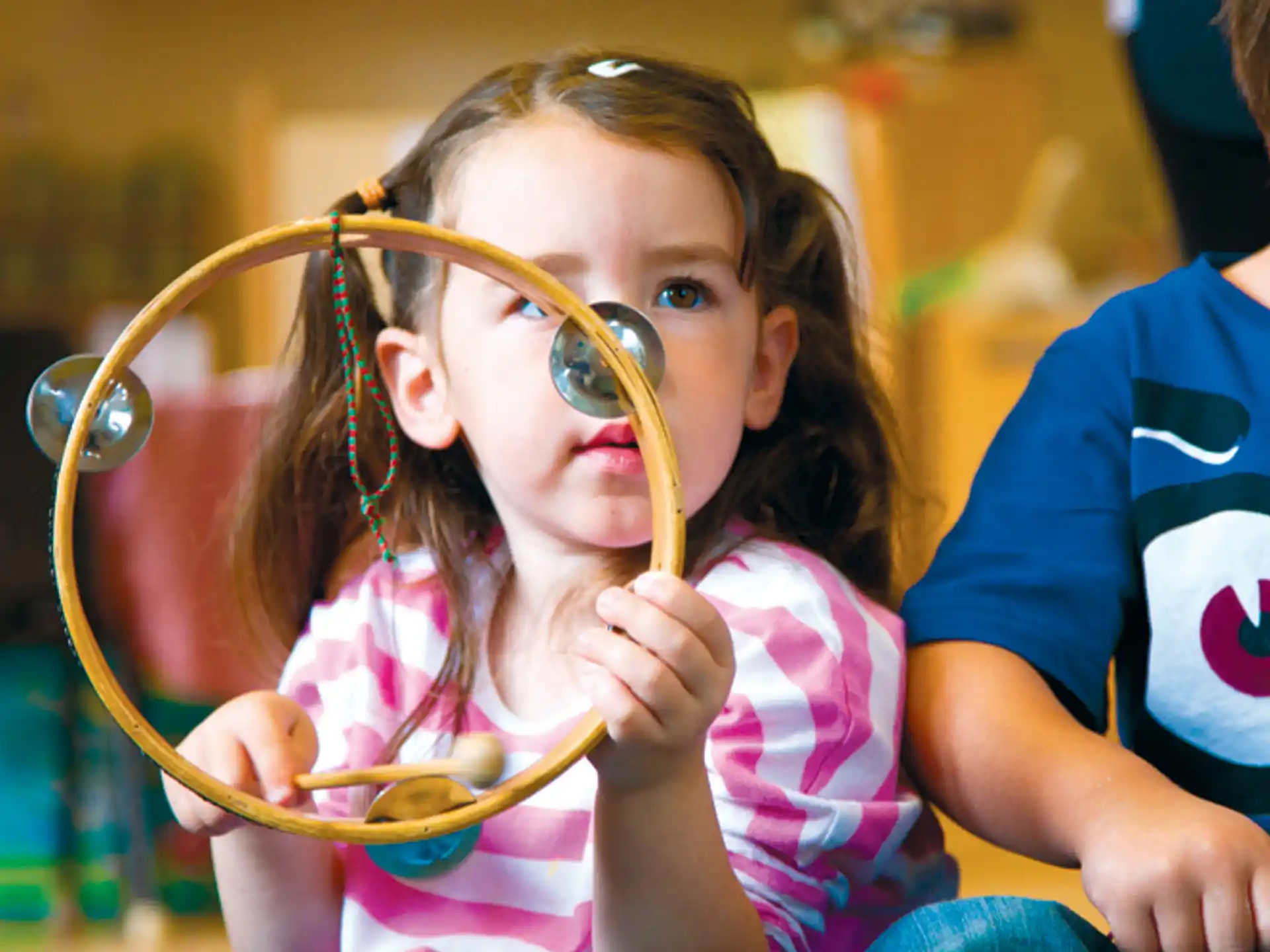 a young girl with a stethoscope around her neck