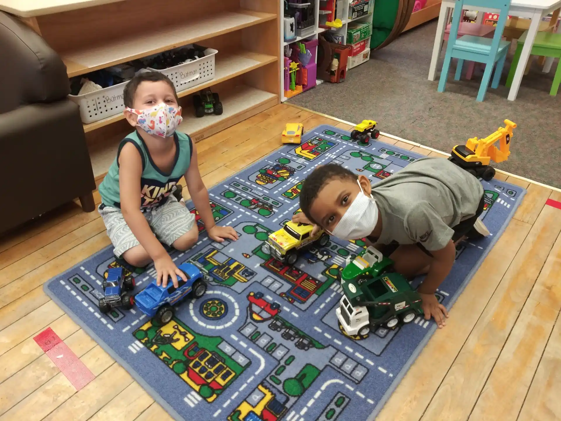 a couple of children playing with toys