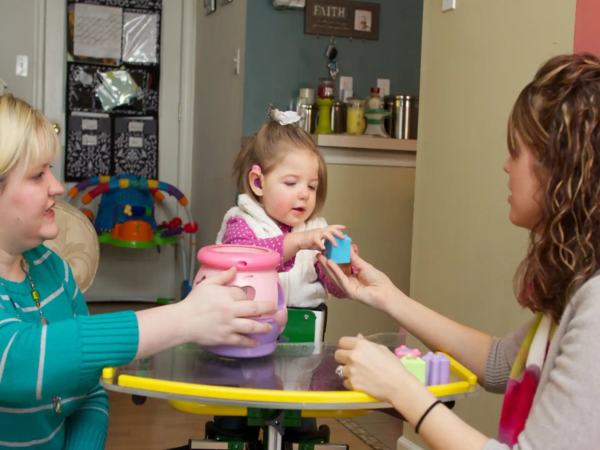 a person and a child playing with toys