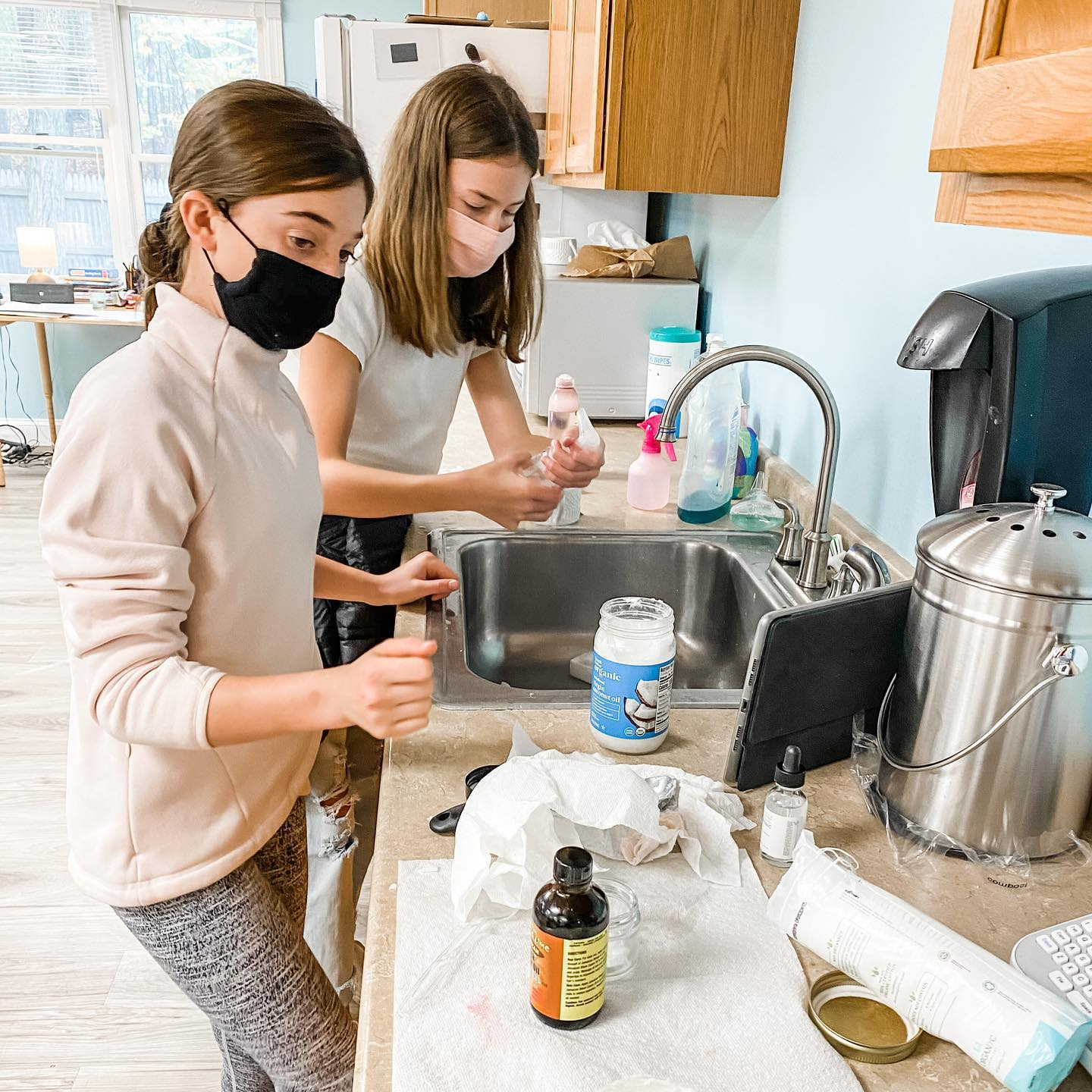 a couple of women in a kitchen