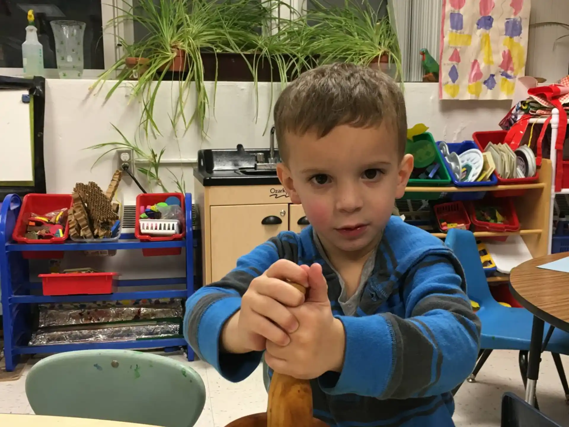 a boy sitting at a table