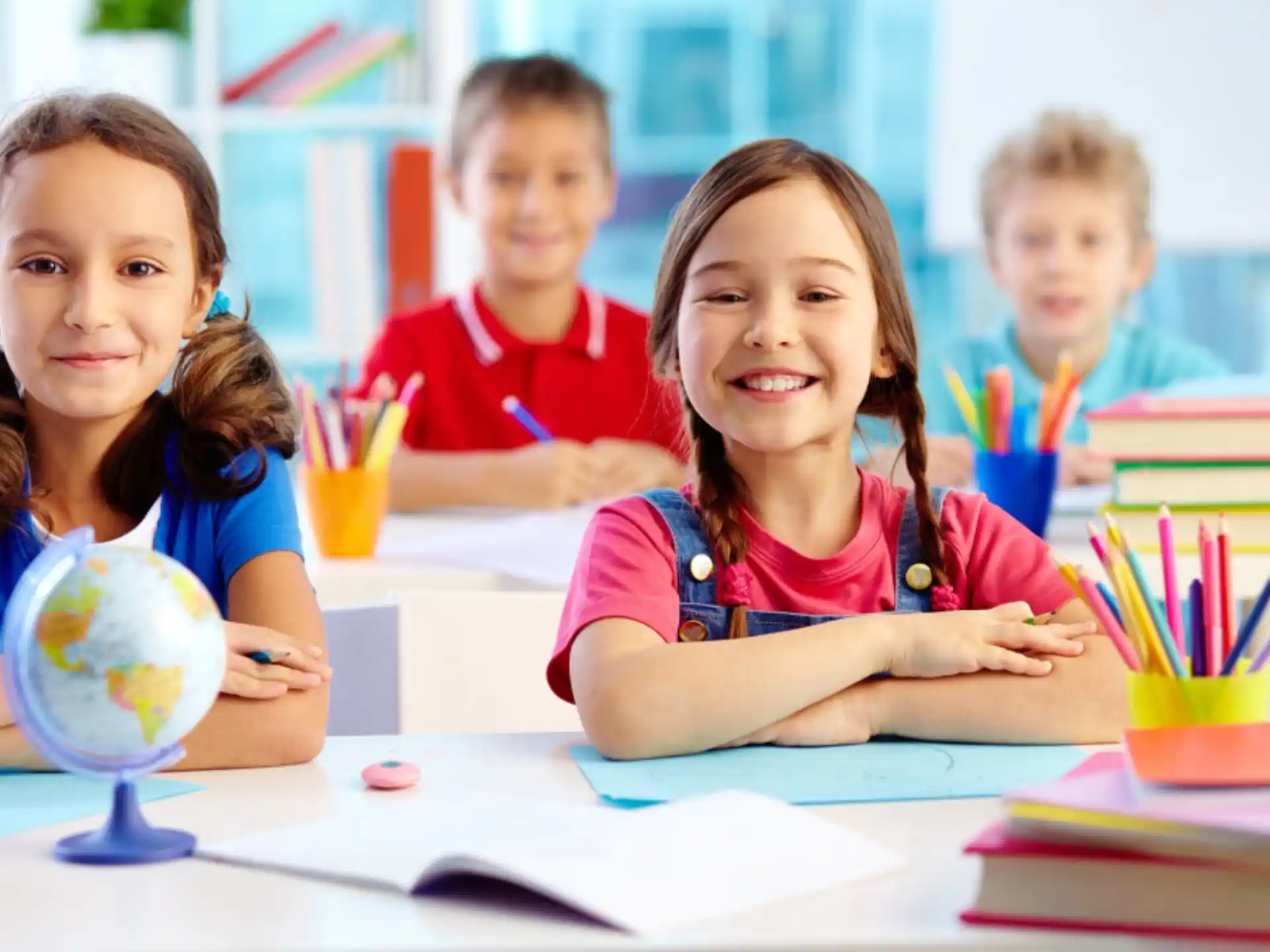 a group of children sitting at a table