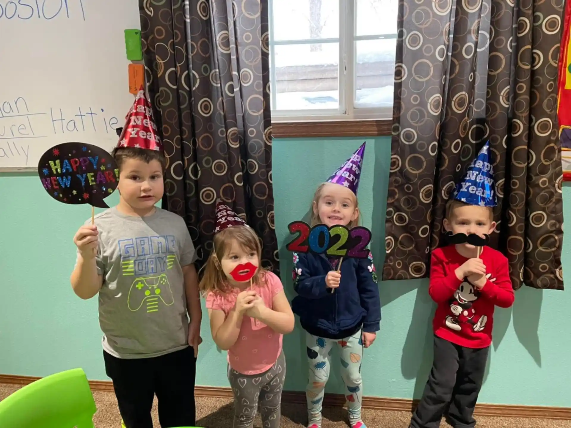 a group of children wearing party hats