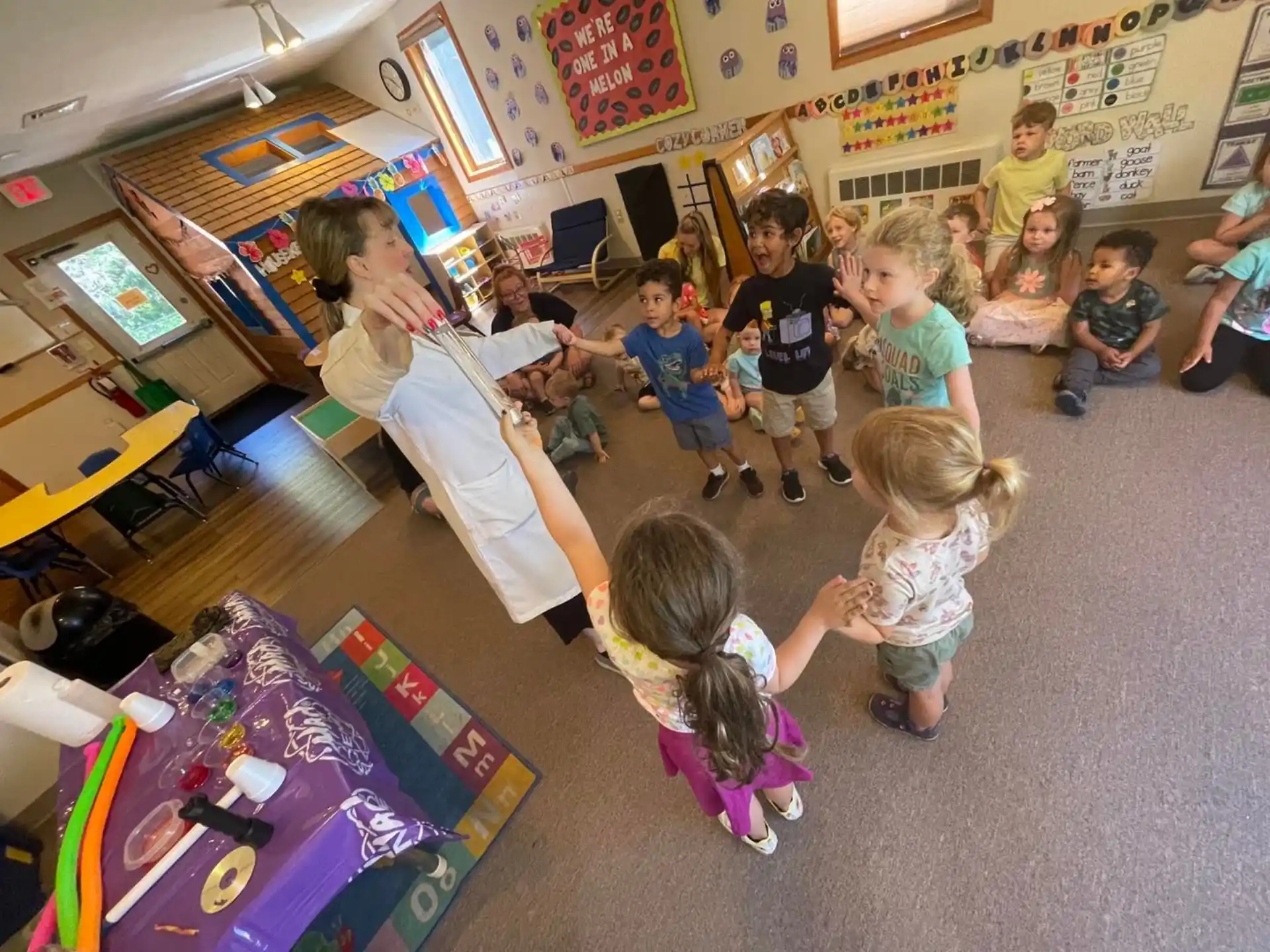 a person teaching children in a classroom