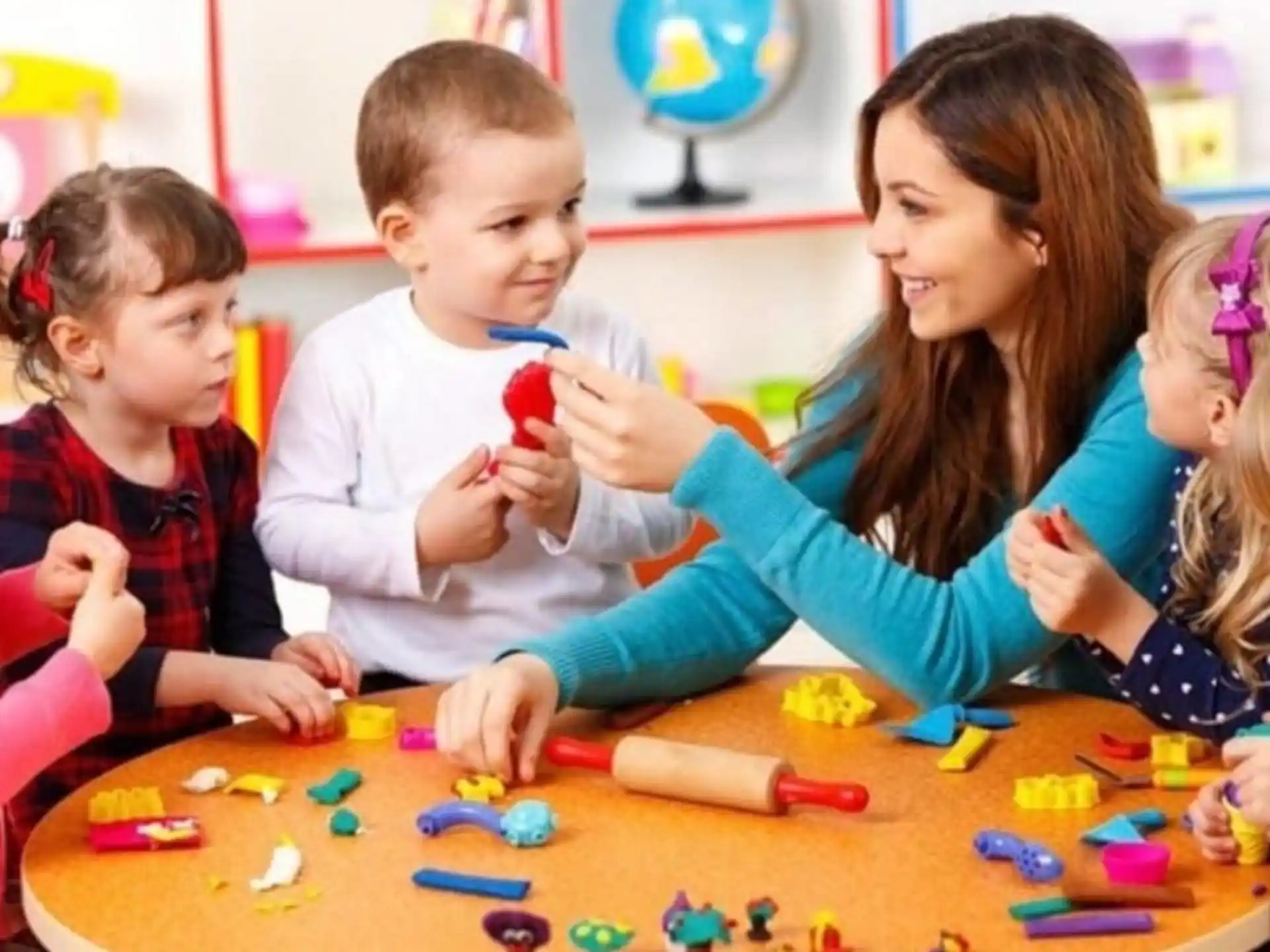 a person and several children playing with toys