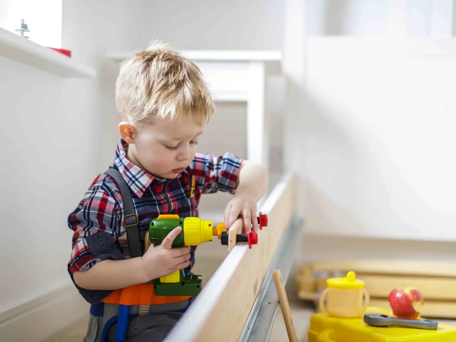 a boy playing with a toy