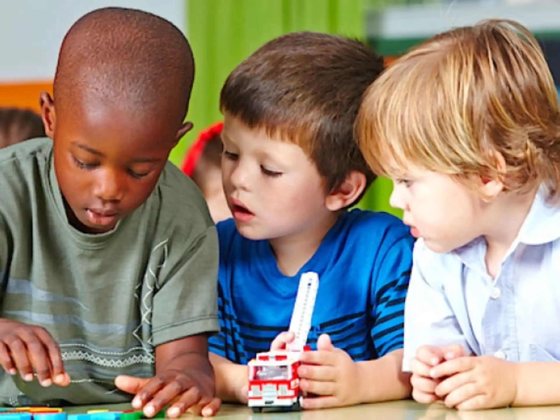 a group of children playing with a toy