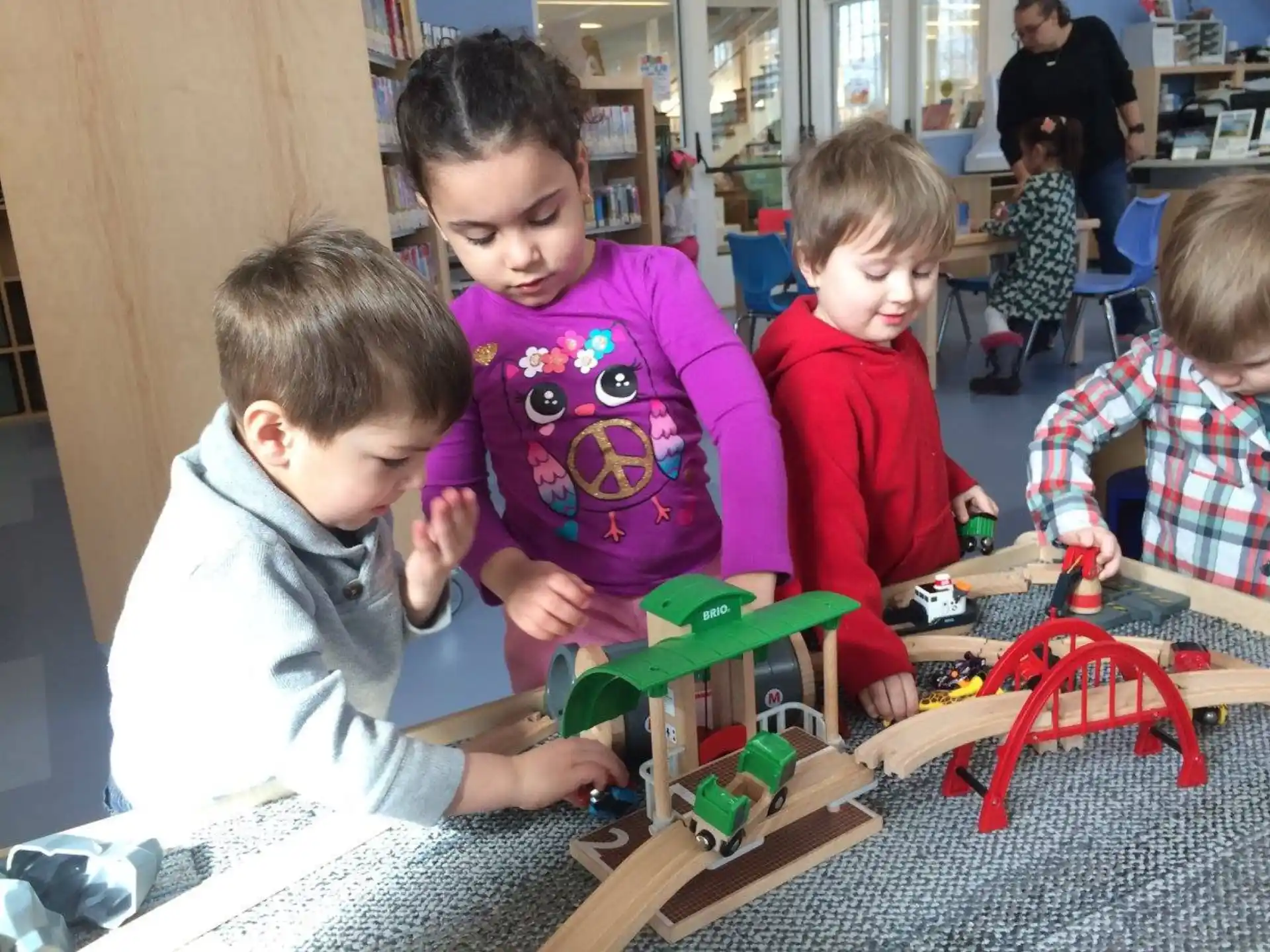 a group of children playing with toys