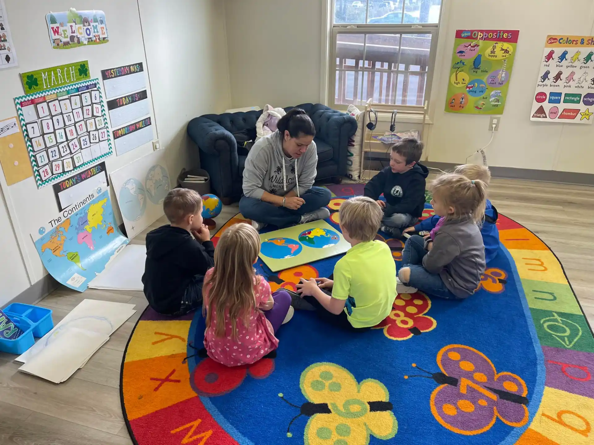 a group of children sitting on the floor
