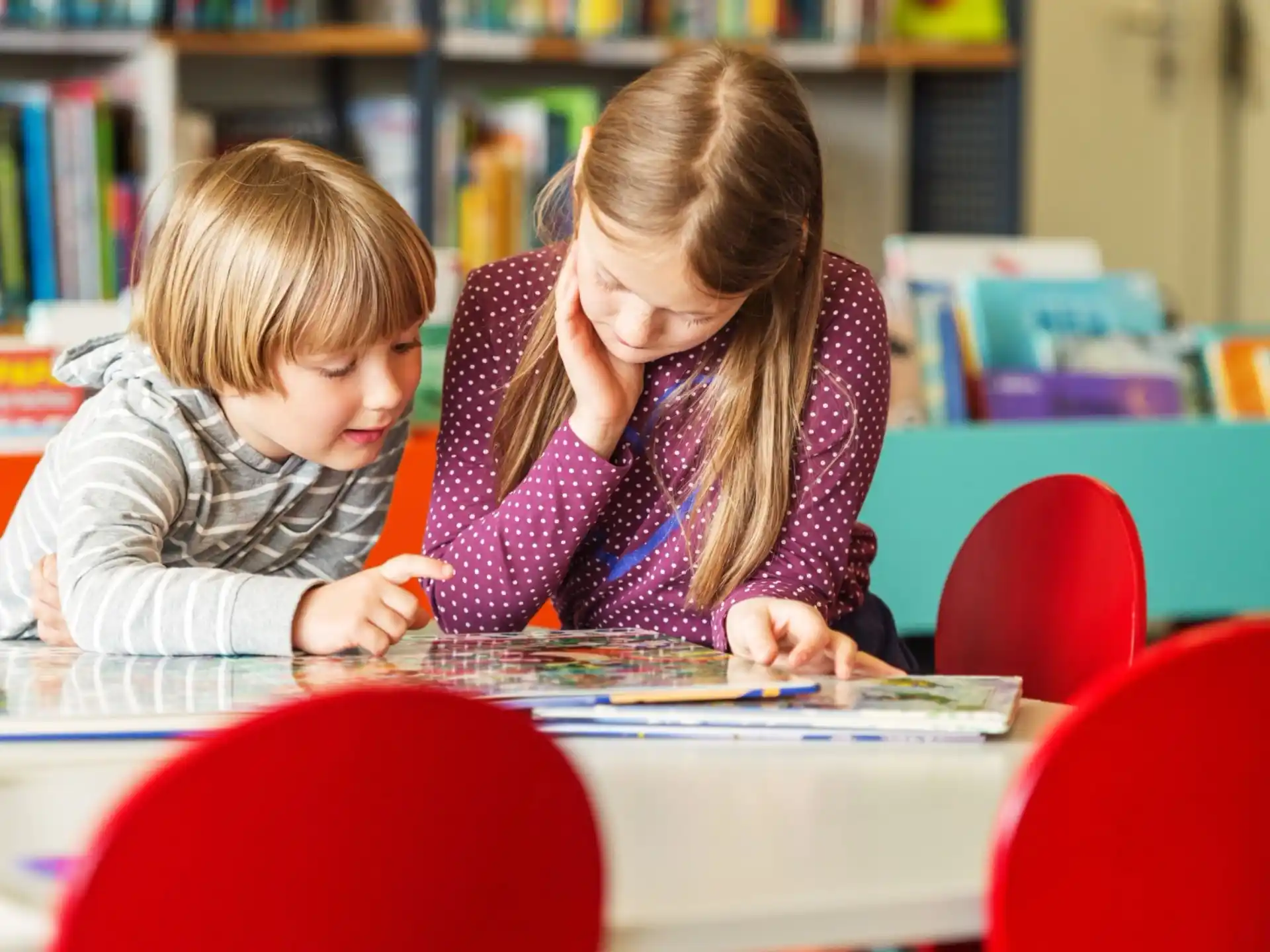 a boy and girl studying