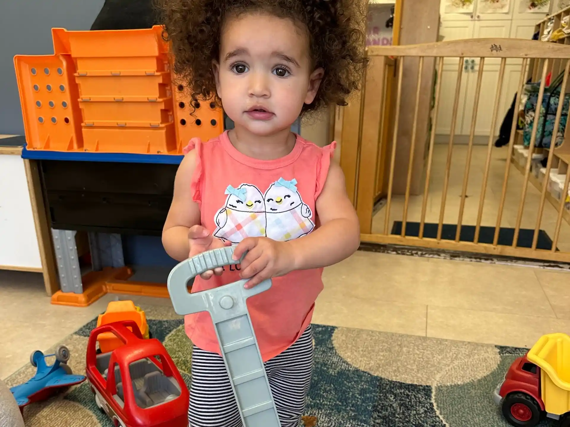 a baby girl on a toy bike