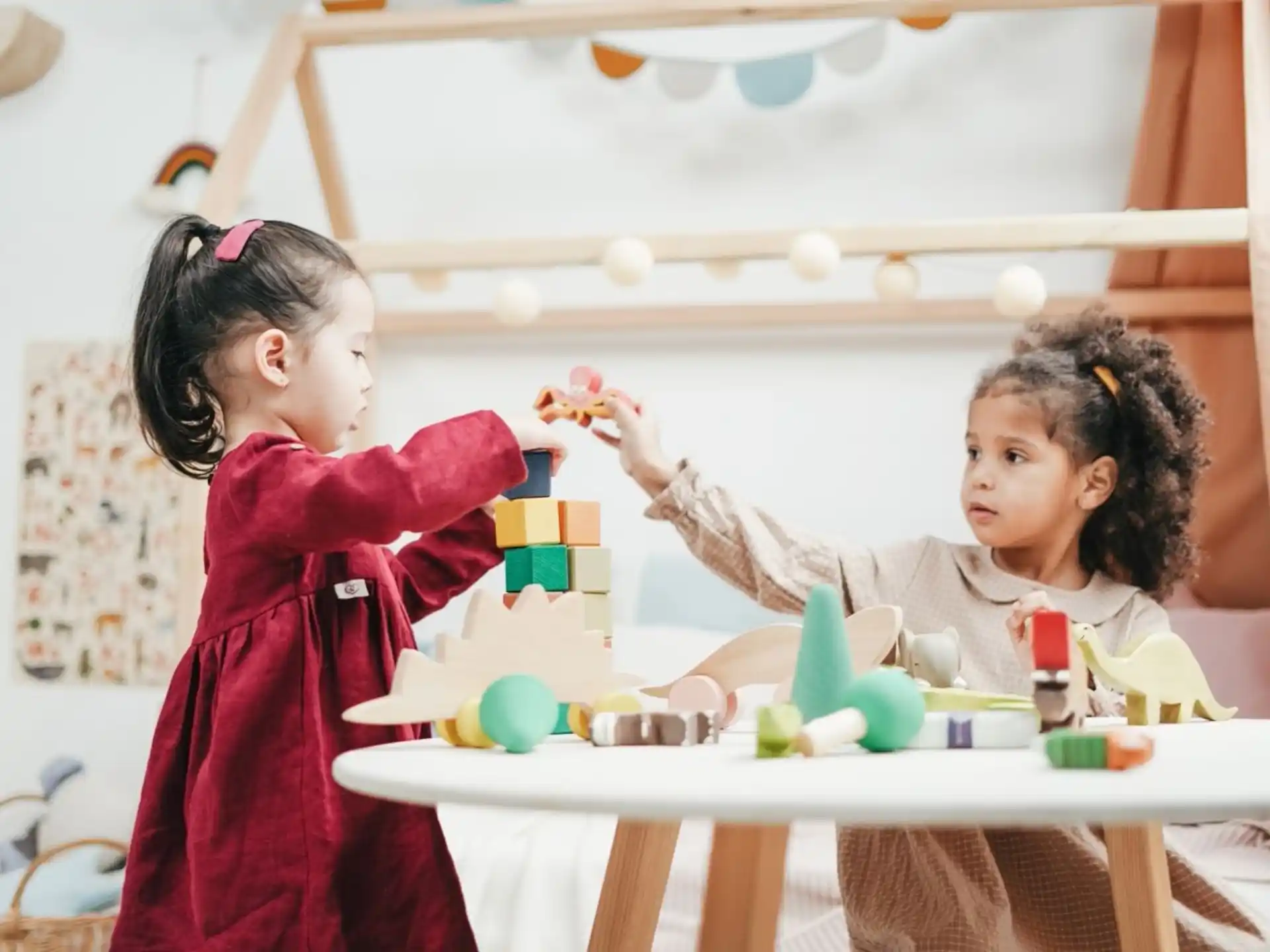 a couple of girls playing with toys