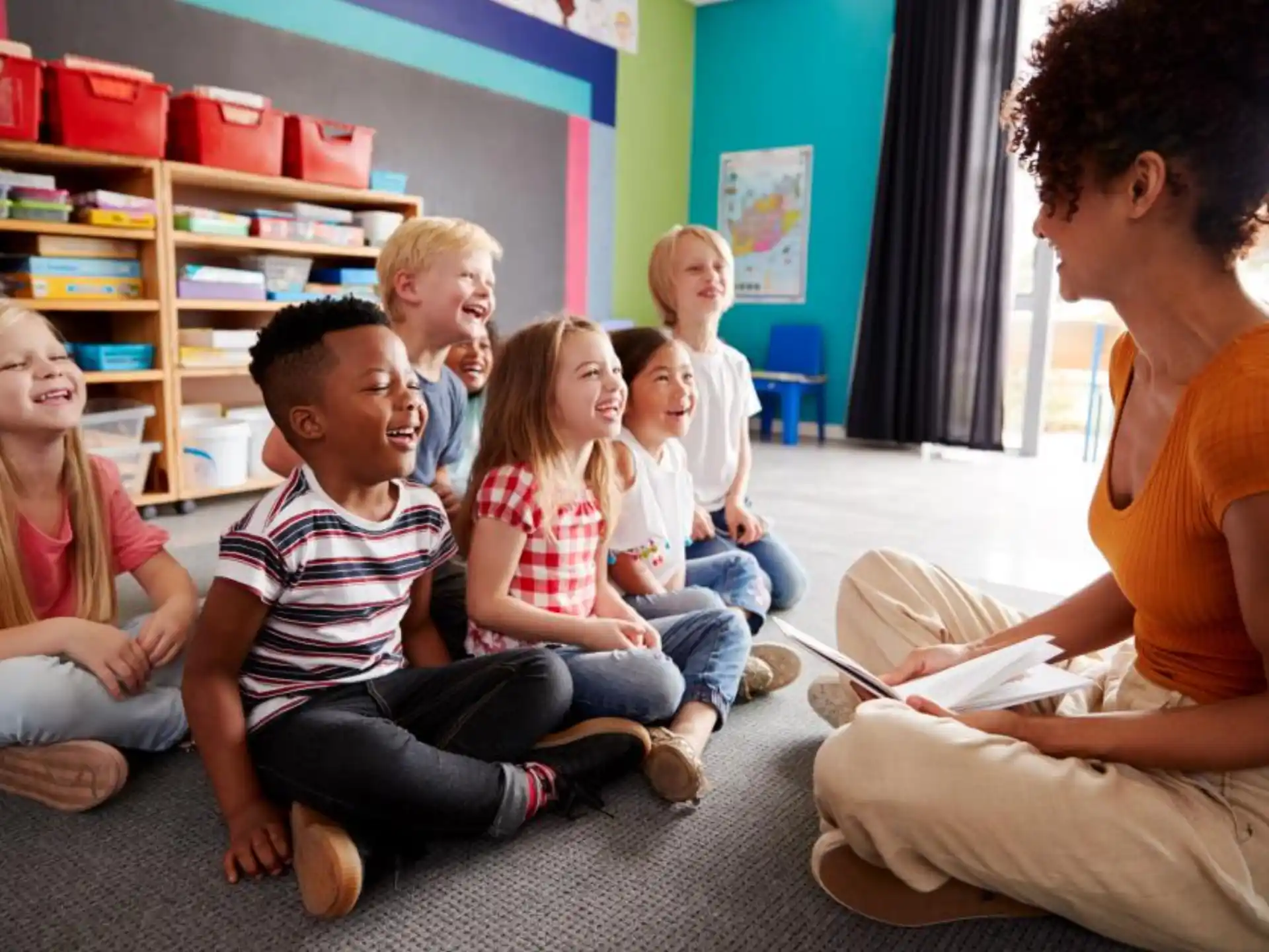 a group of children sitting in a classroom