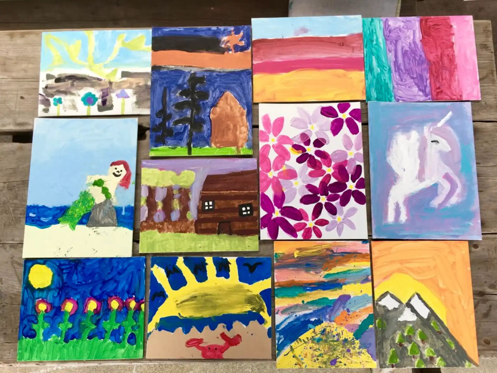 a group of paintings on a wall
