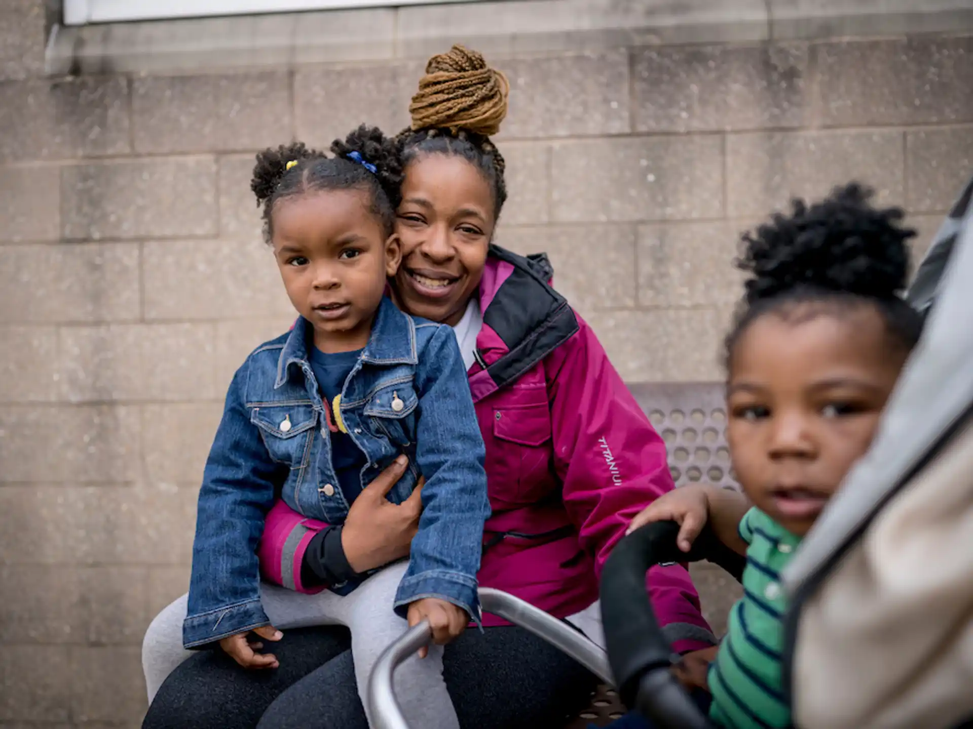 a group of children sitting on a bench
