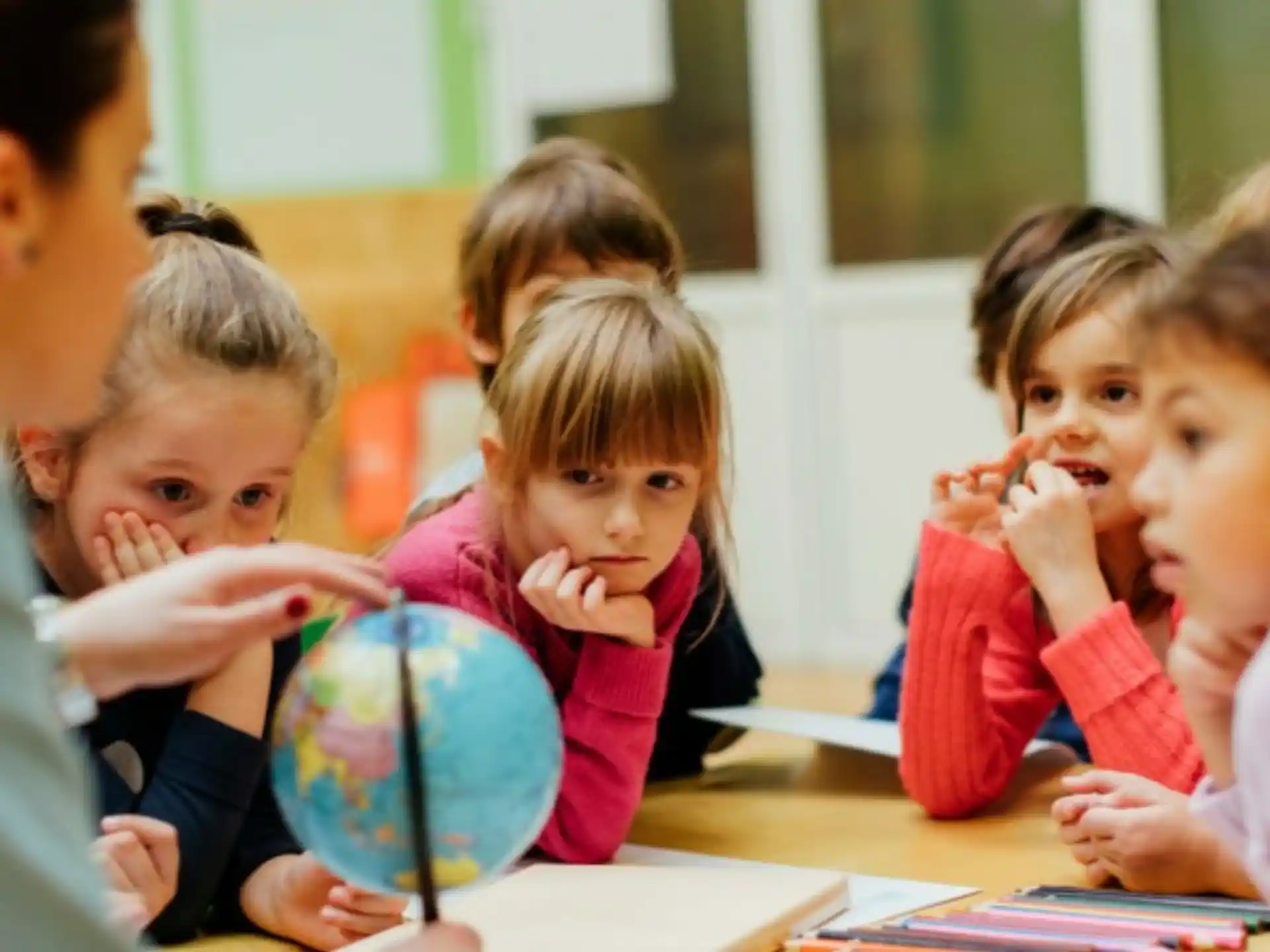 a group of children sitting at desks