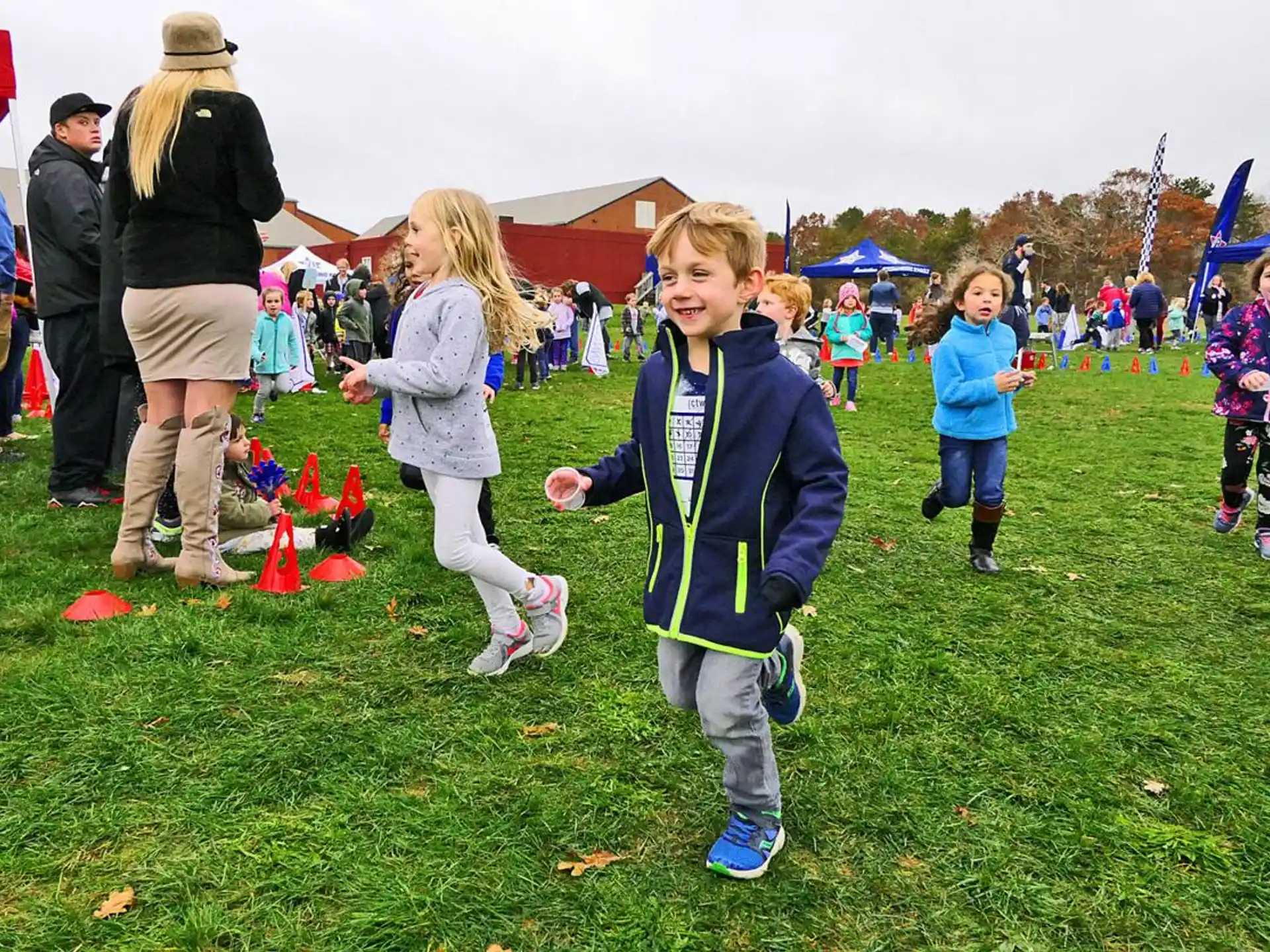 a group of children playing in a field