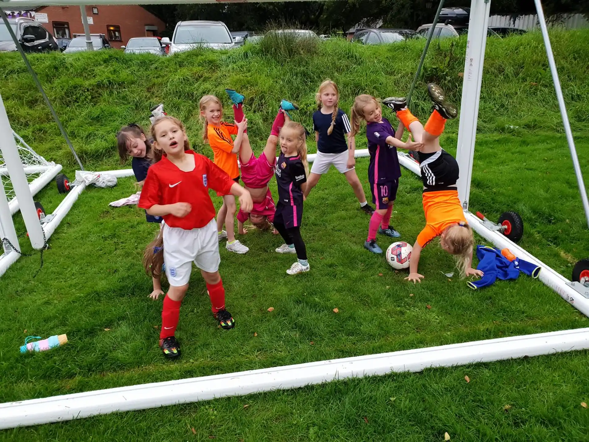 a group of kids playing football