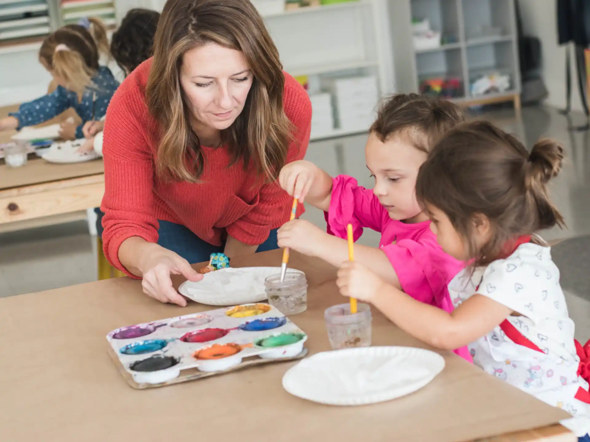 a person and a child painting