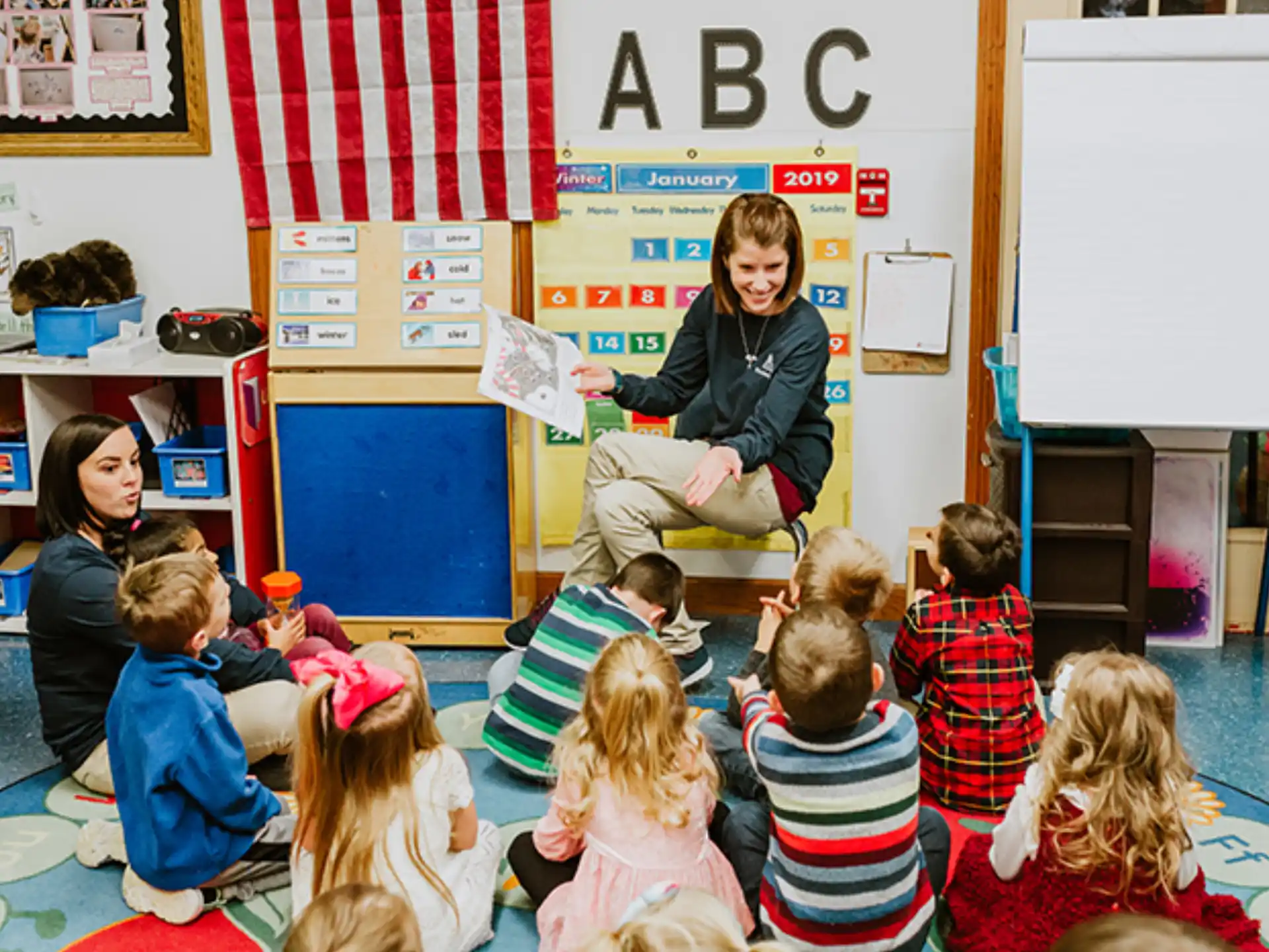 a person teaching a group of children