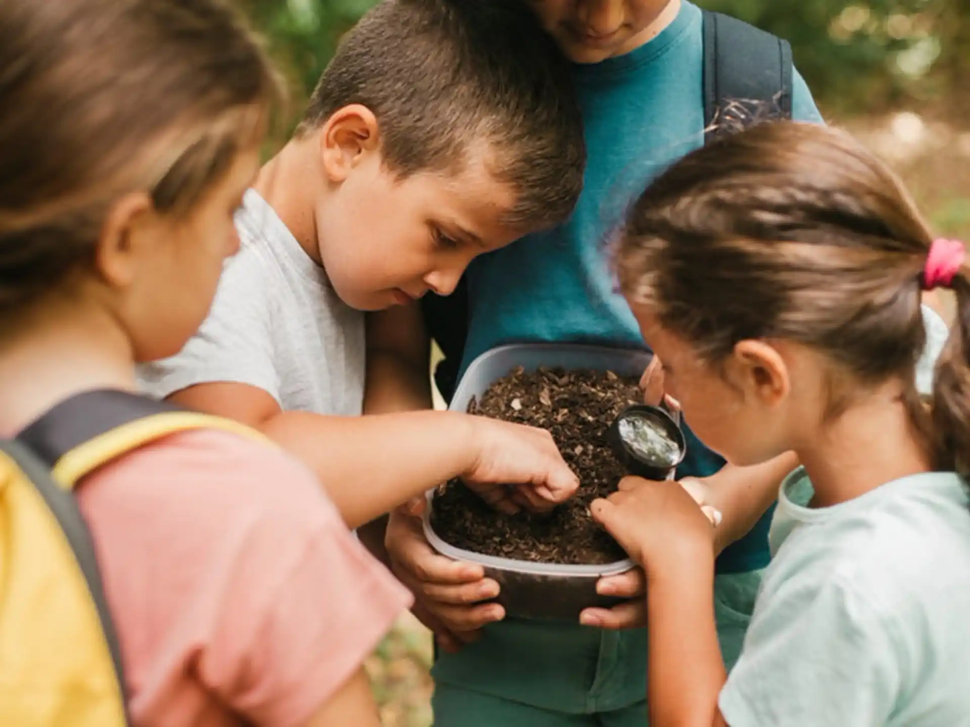 a group of children looking at a chocolate cake