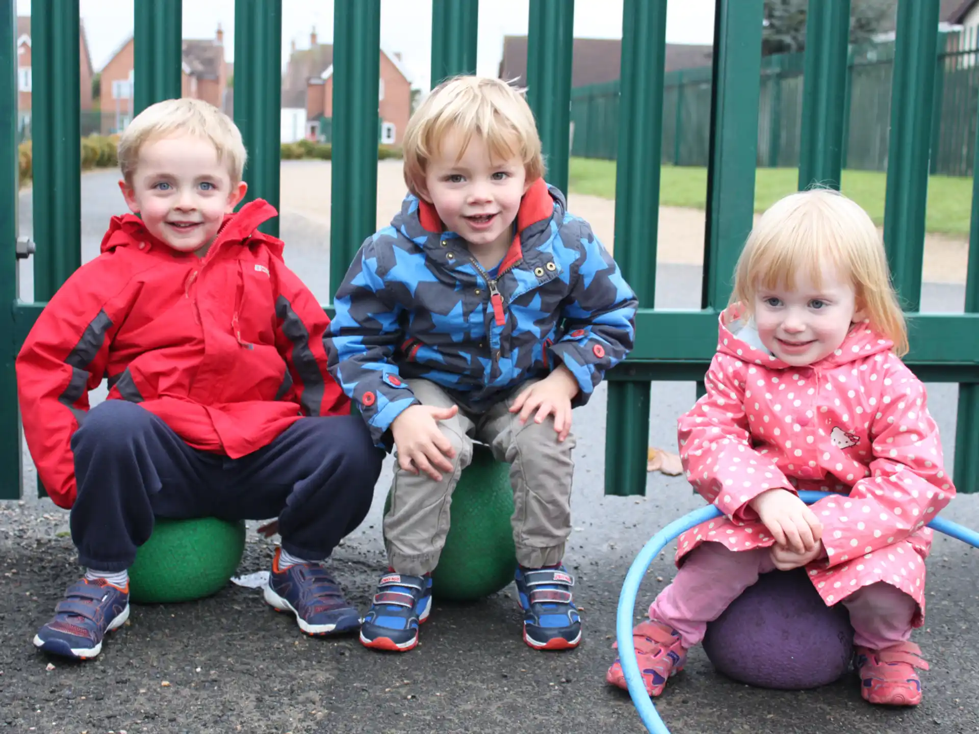 a group of children sitting on a bench