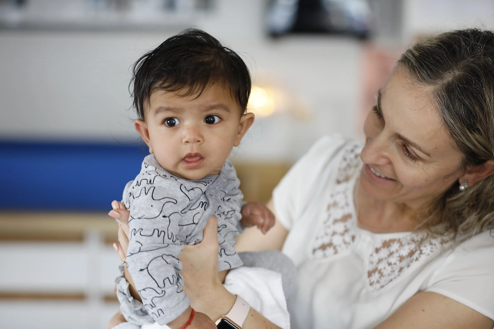 a person holding a baby