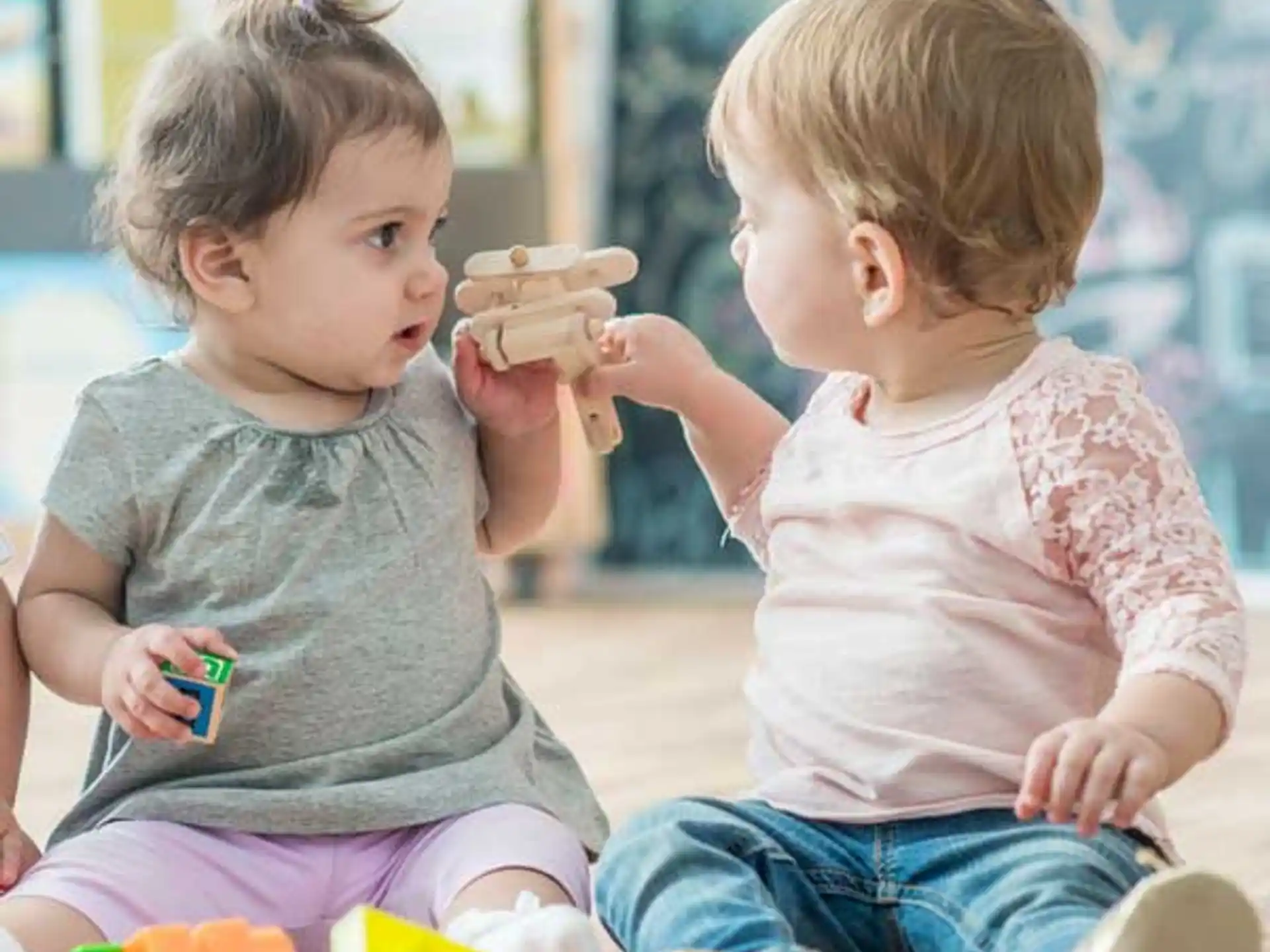 a couple of young children eating