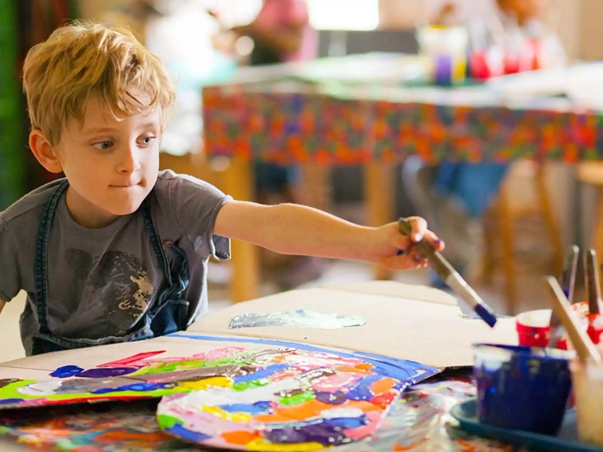a young boy painting
