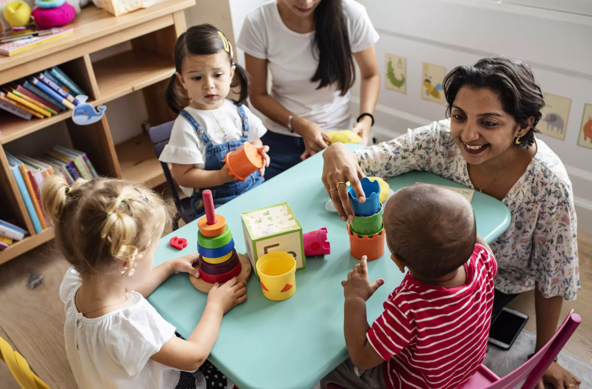 a person and children playing with toys