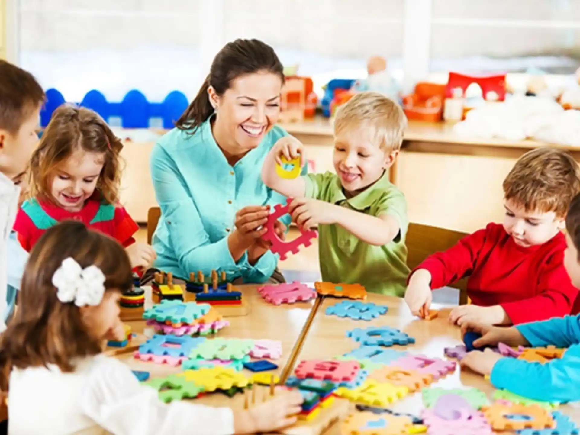 a person and several children sitting at a table