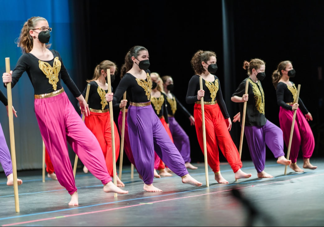 a group of people performing on a stage