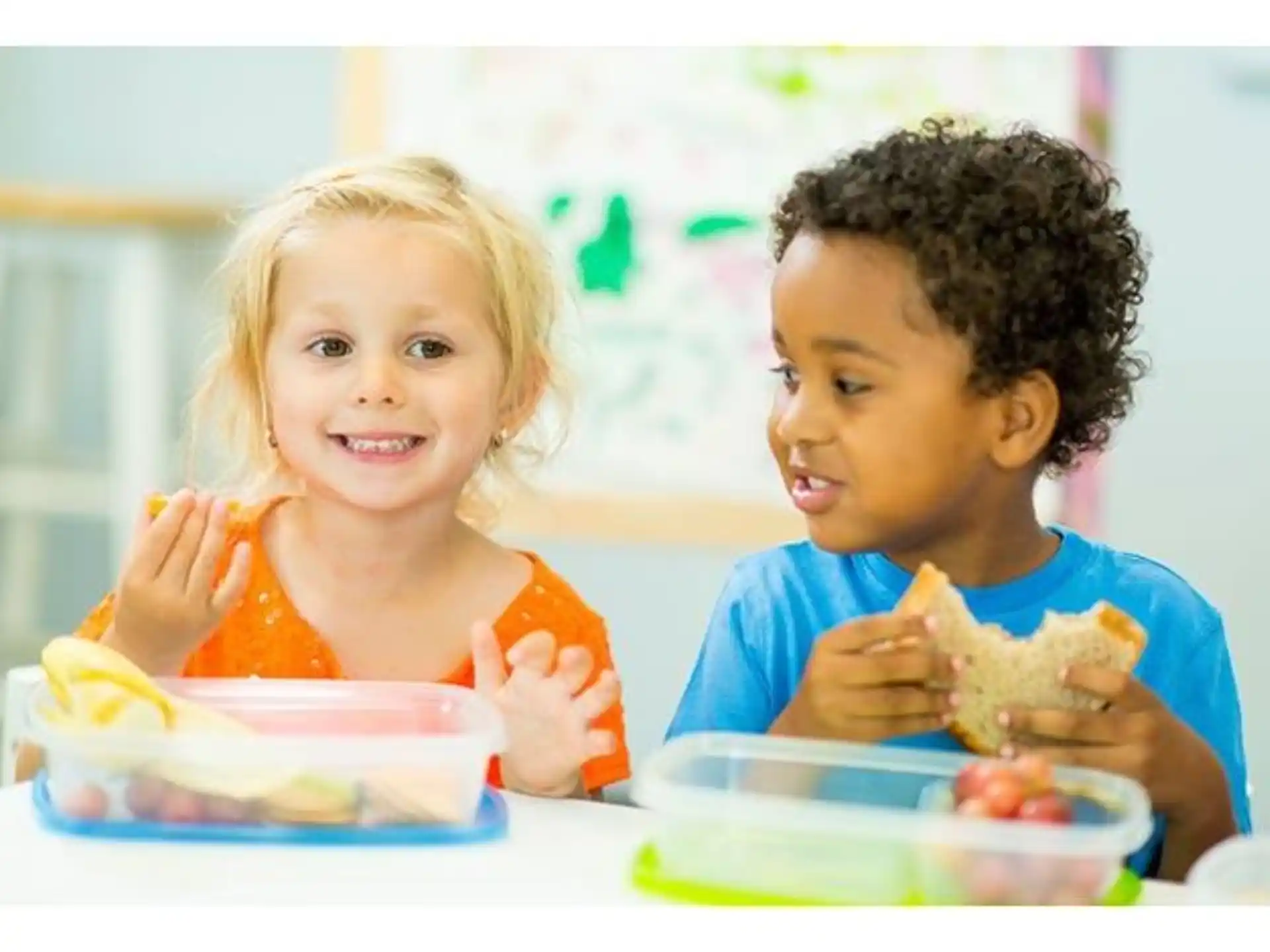a couple of kids eating