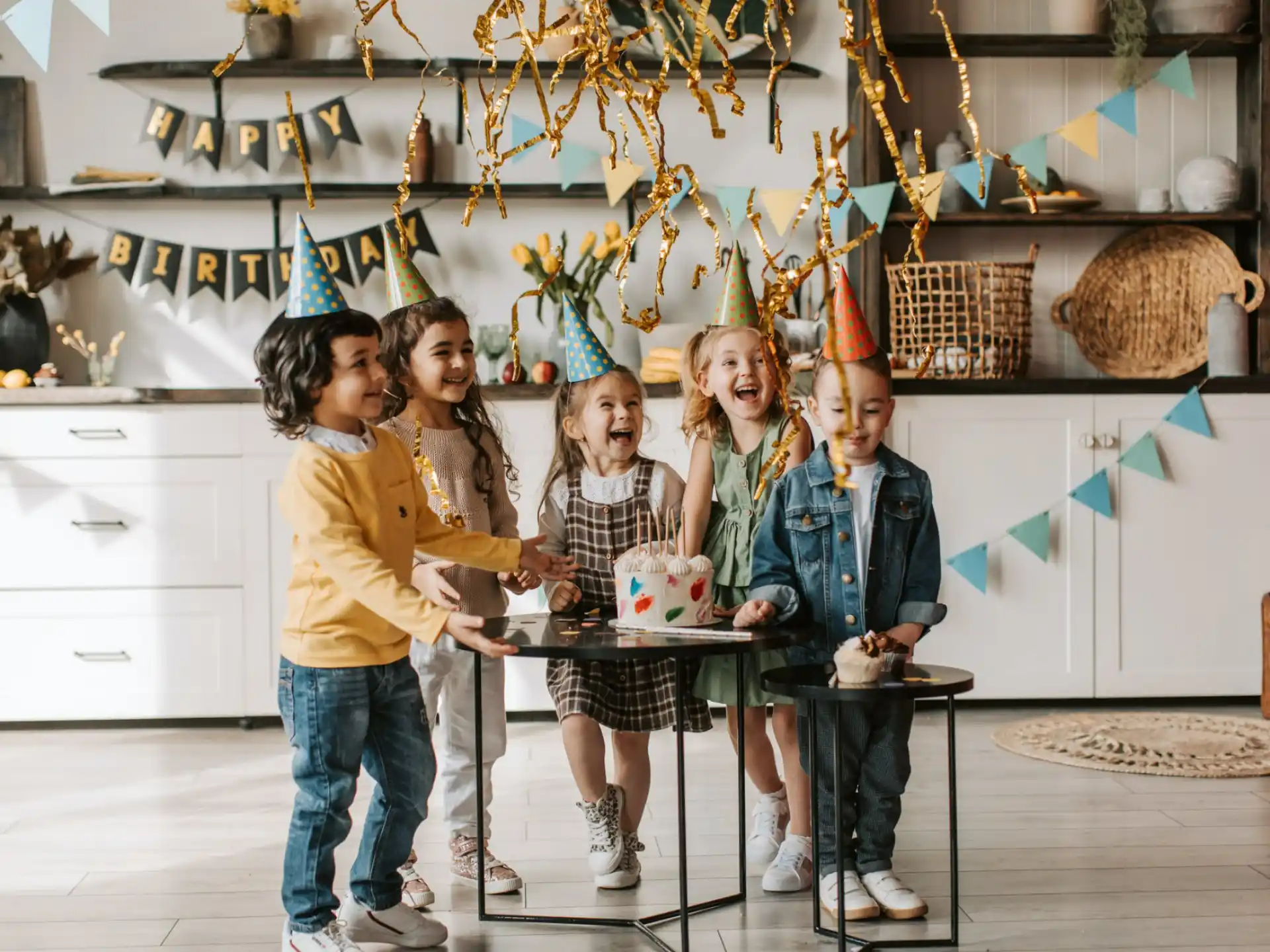 a group of people standing around a table with food on it