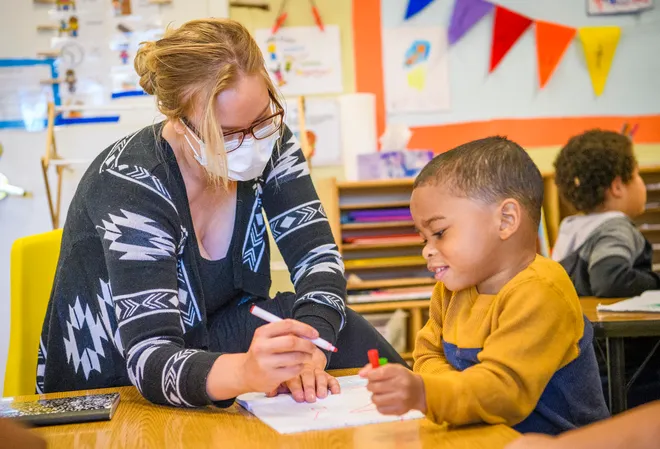 a teacher helping a student