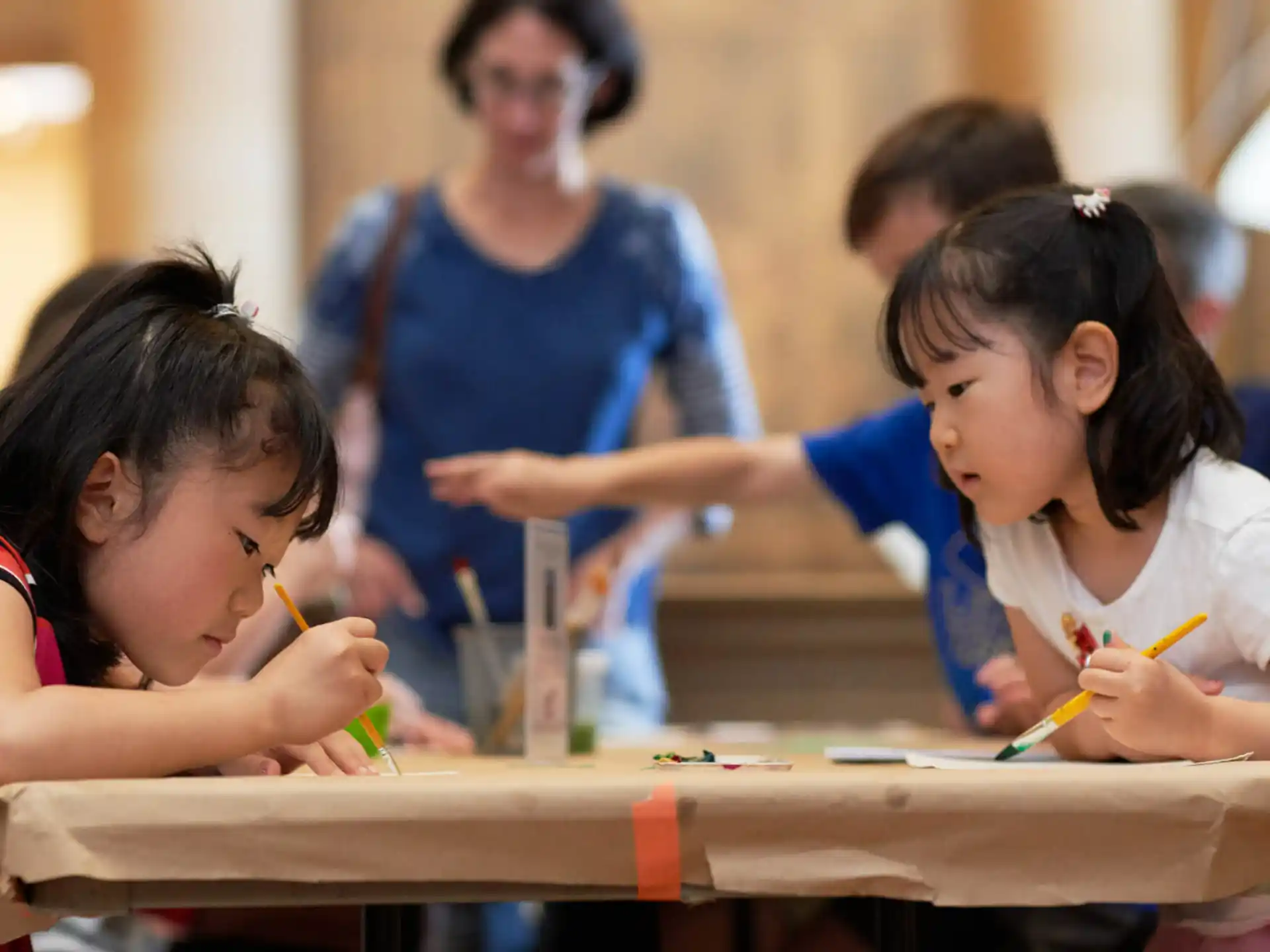 a group of children painting